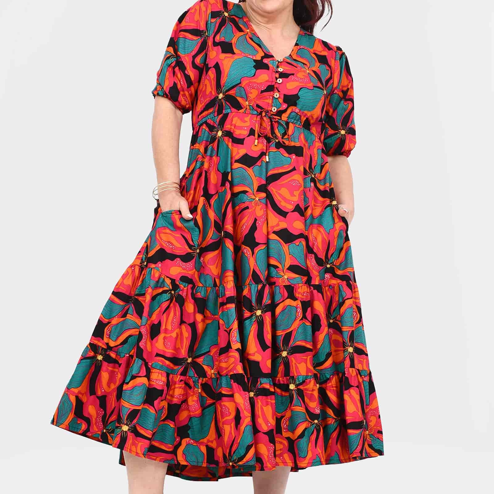 Tiered midi dress in vibrant coral and teal floral print, short puff sleeves, A-line skirt