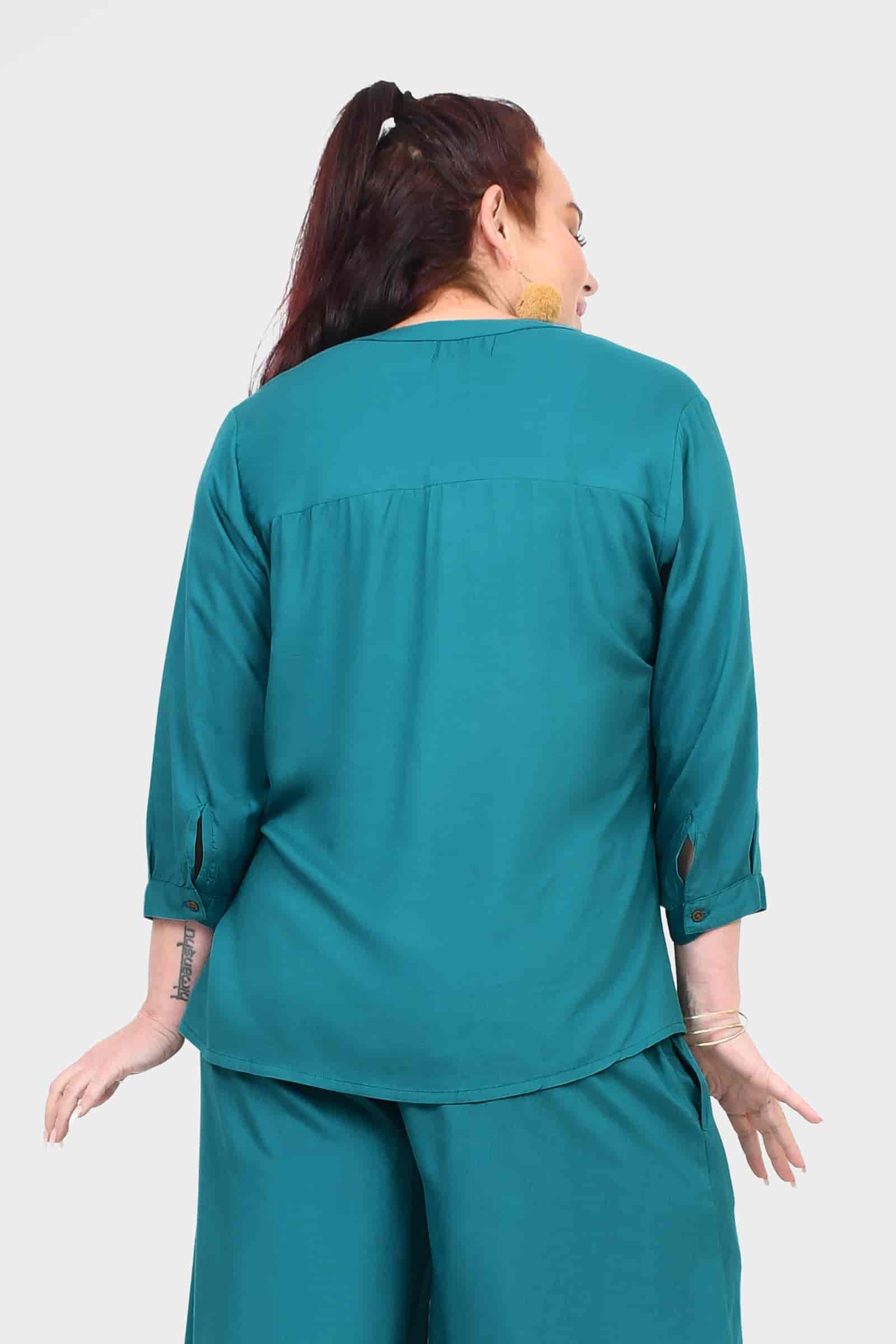 Back view of teal blouse top with button placket and three-quarter sleeves