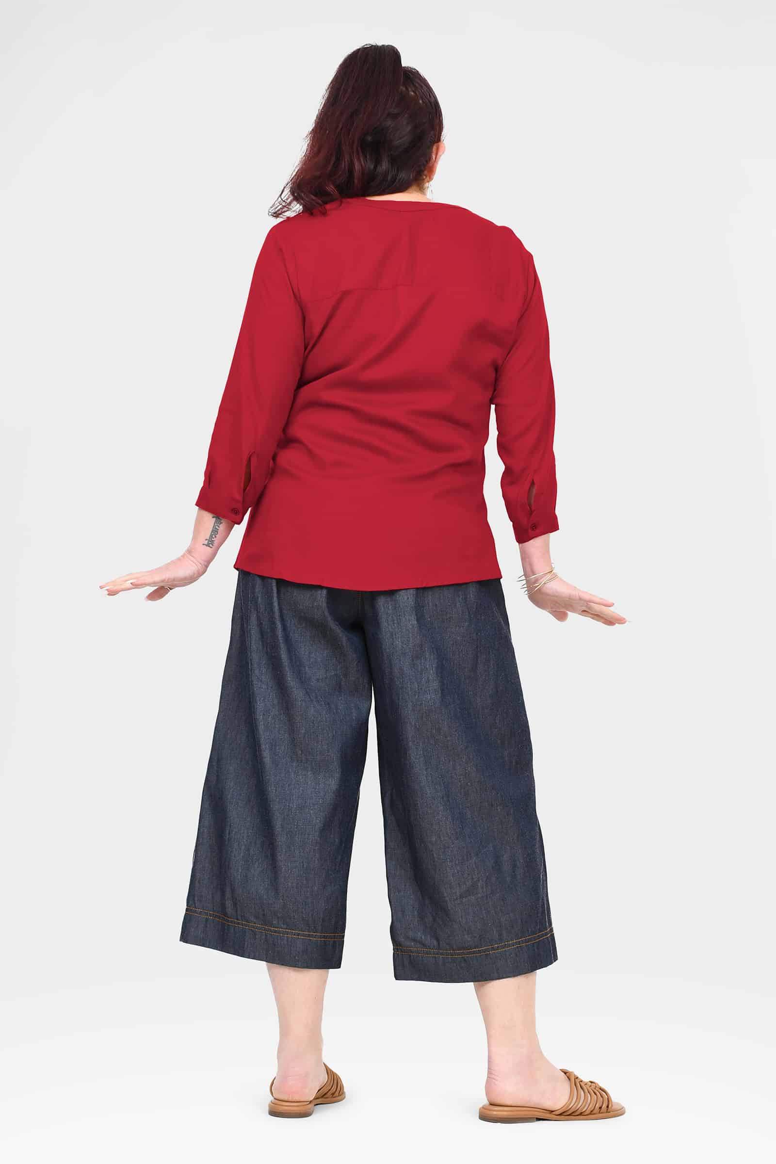 Blue denim 3/4 cropped pants, back view, with wide legs