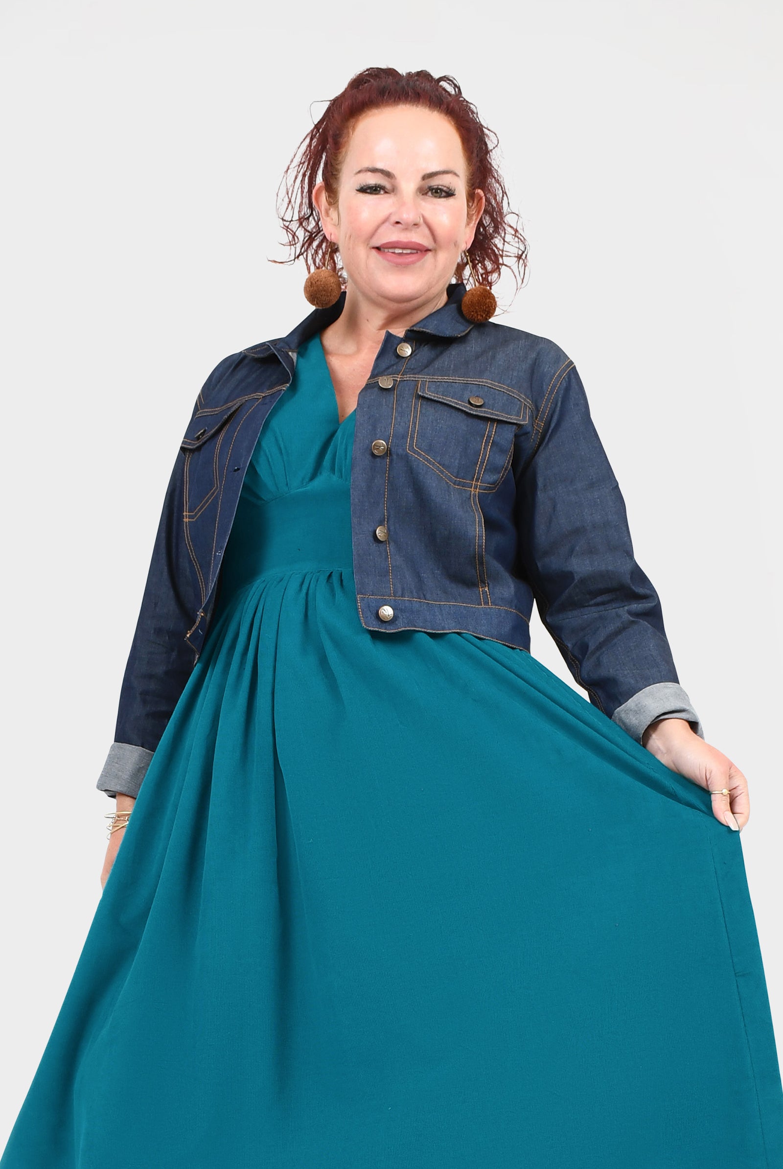 Dark blue denim jacket with chest flap pockets and metal snap buttons