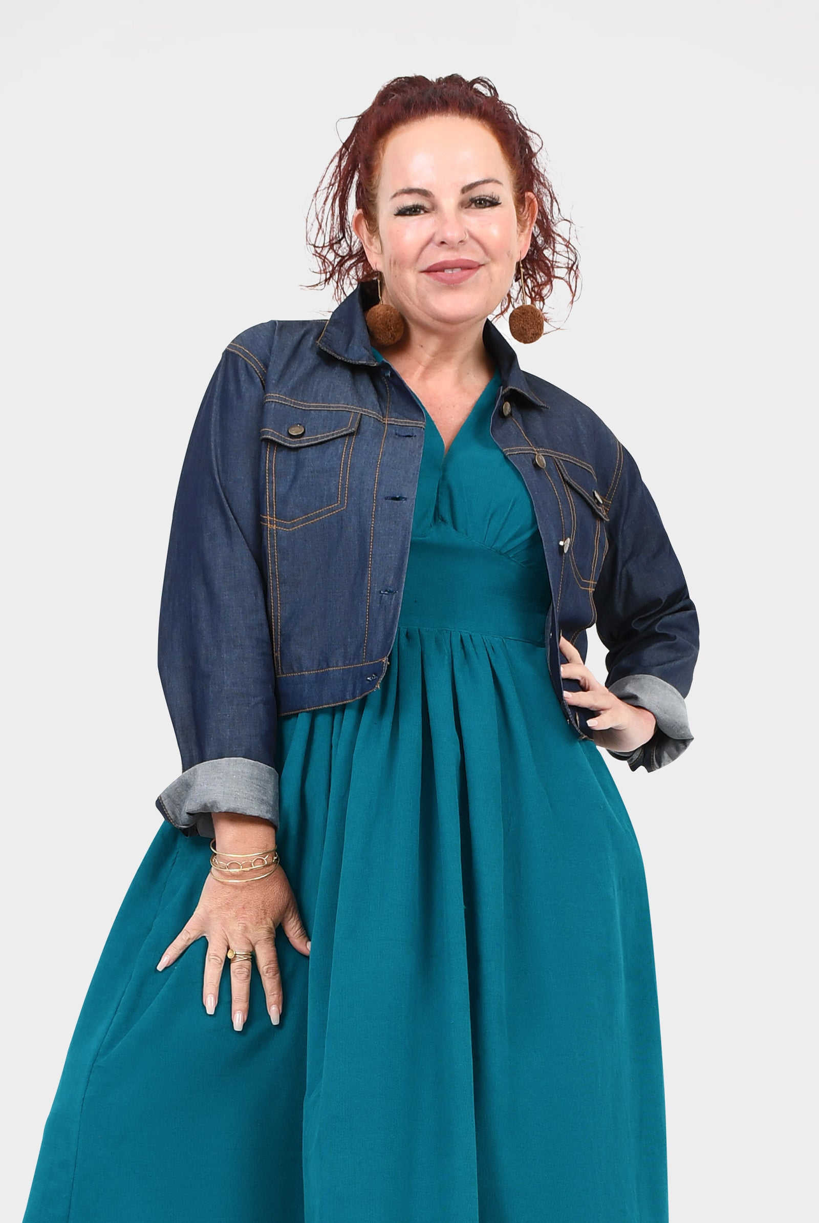 Dark blue denim jacket with pointed collar and front flap pockets