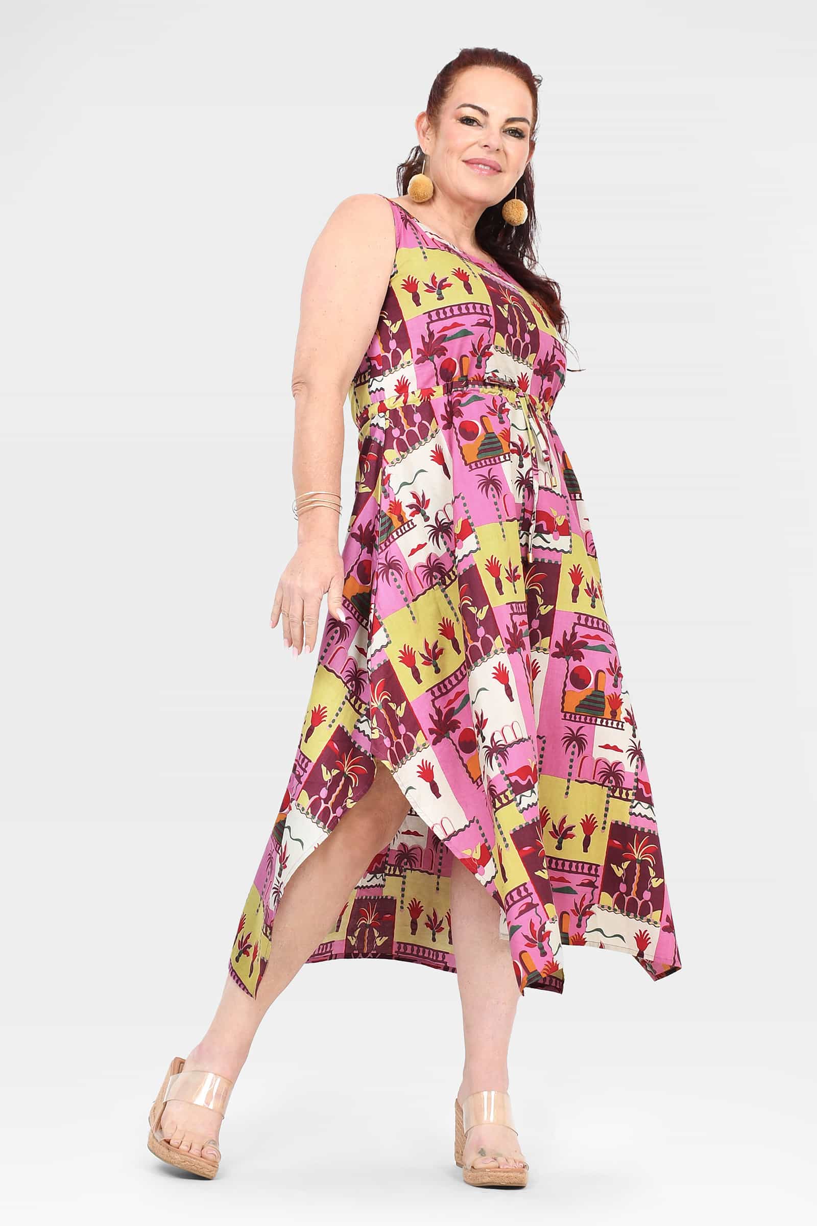Pink sleeveless midi dress with asymmetrical hem and tropical animal print, patchwork blocks.