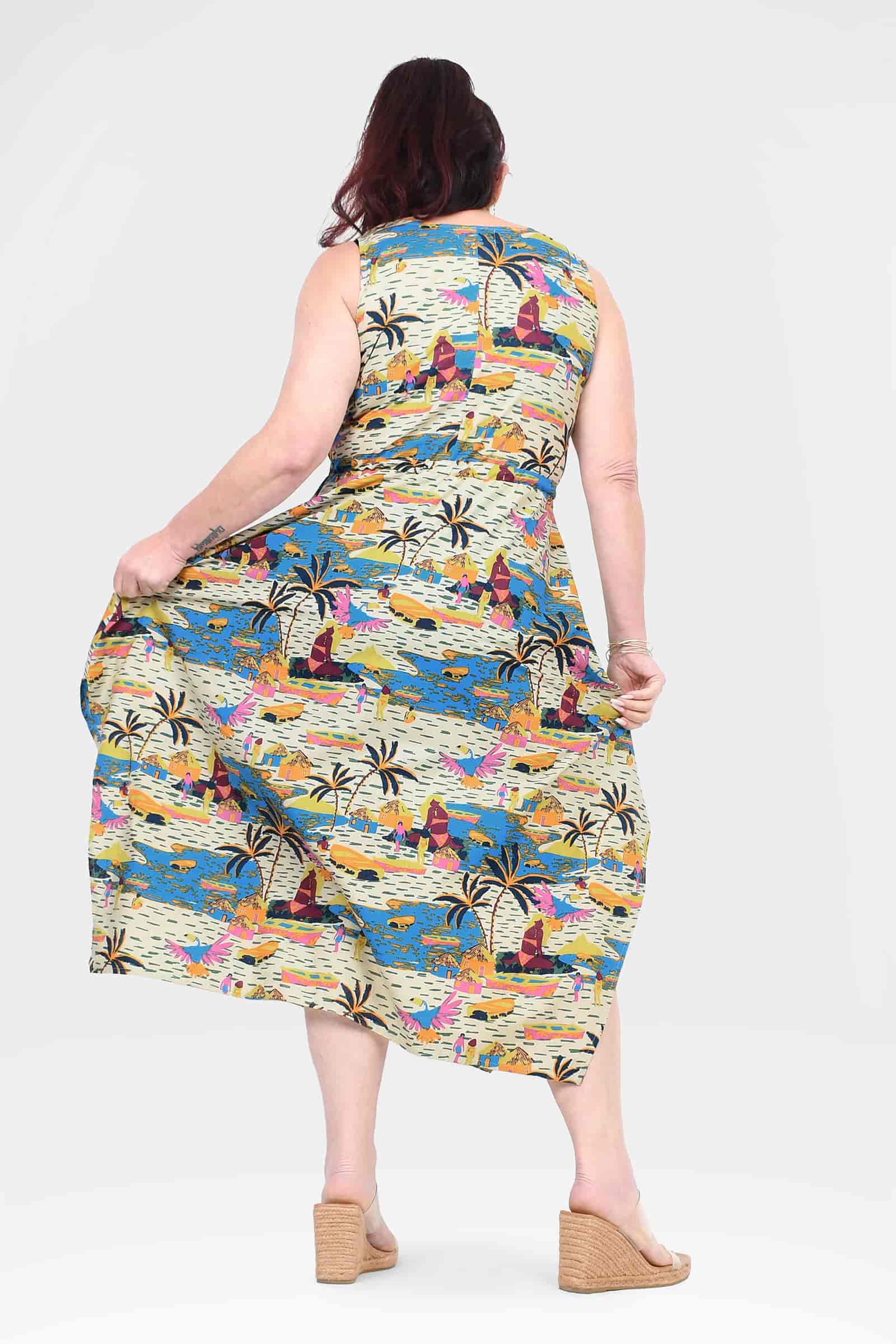 Back-view sleeveless capri dress in colorful city-and-palm print, flowing midi length