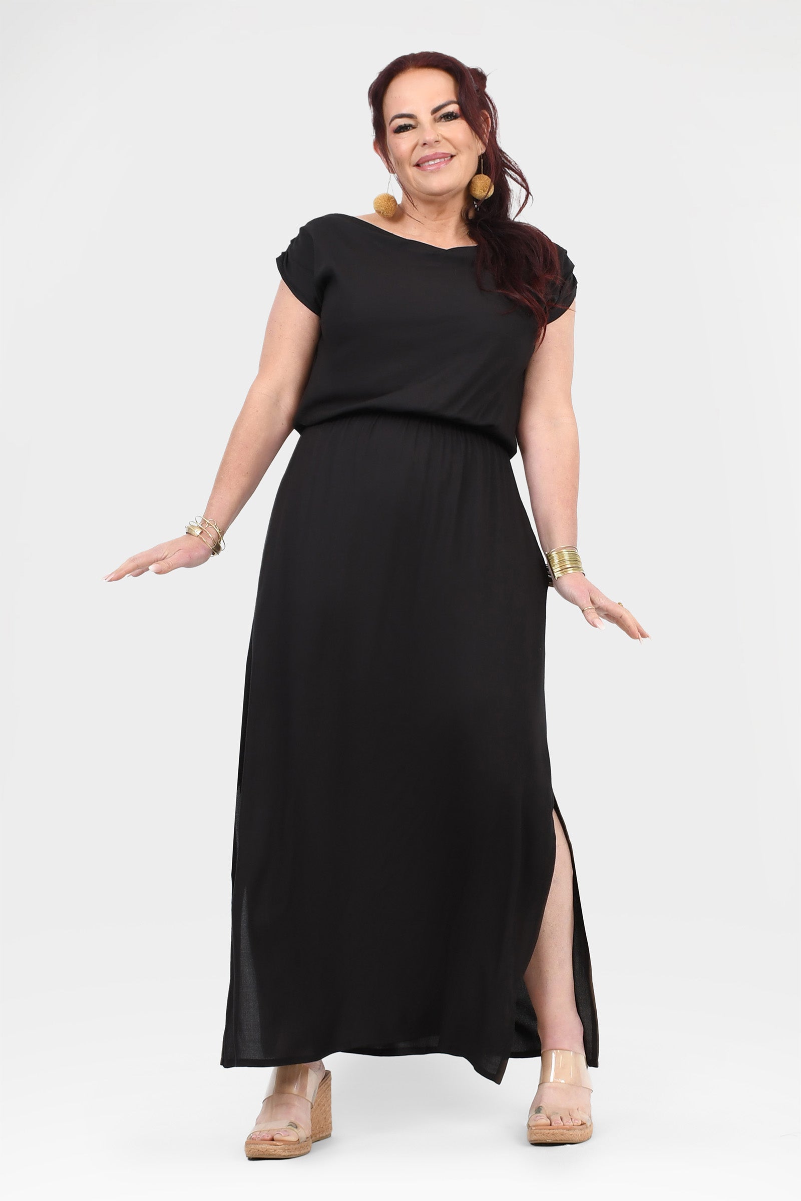 Black maxi dress with short sleeves and gathered waist, long skirt with side opening