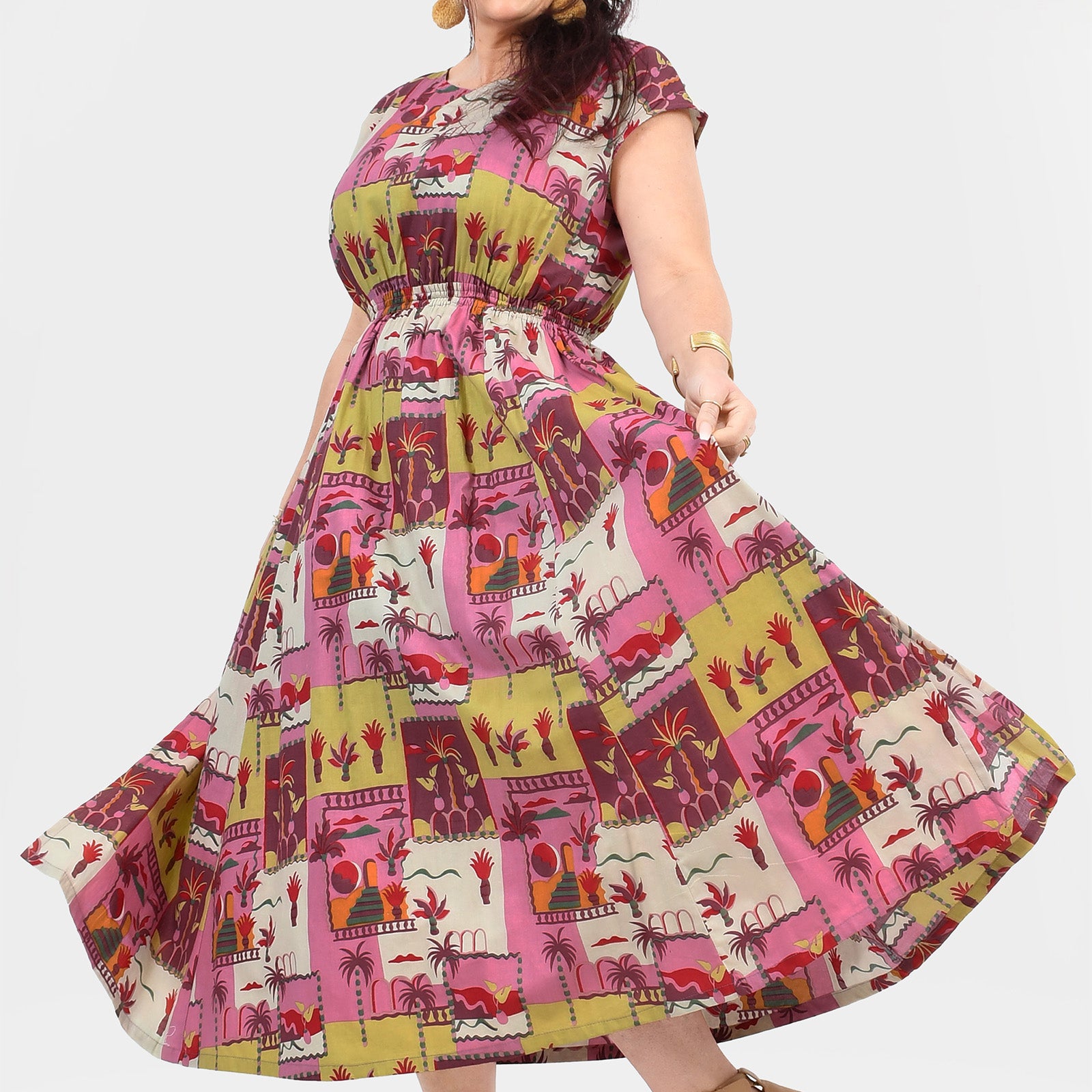 Pink long dress with colorful animal and cactus print, tiered flared skirt
