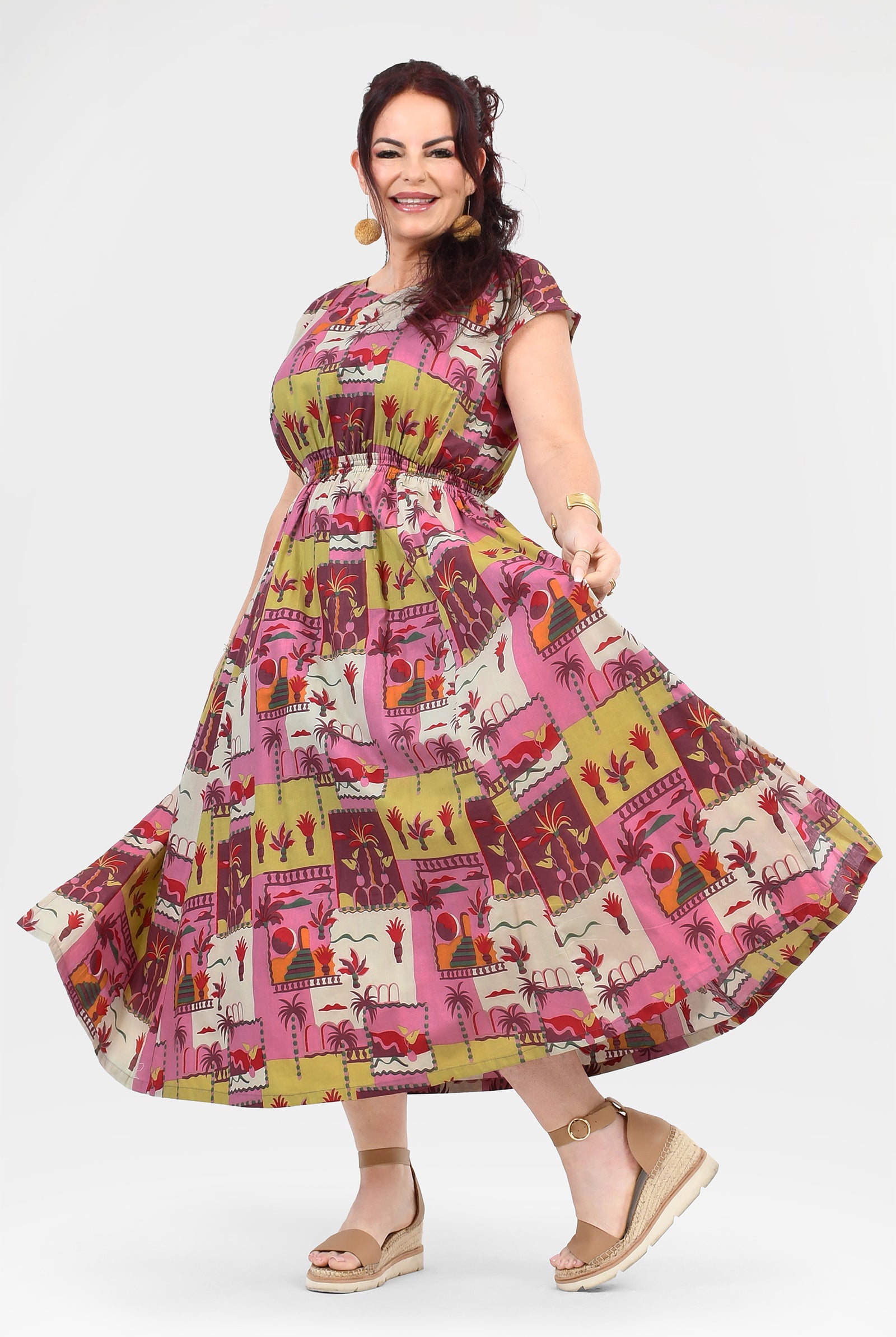 Pink long dress with colorful animal and cactus print, tiered flared skirt