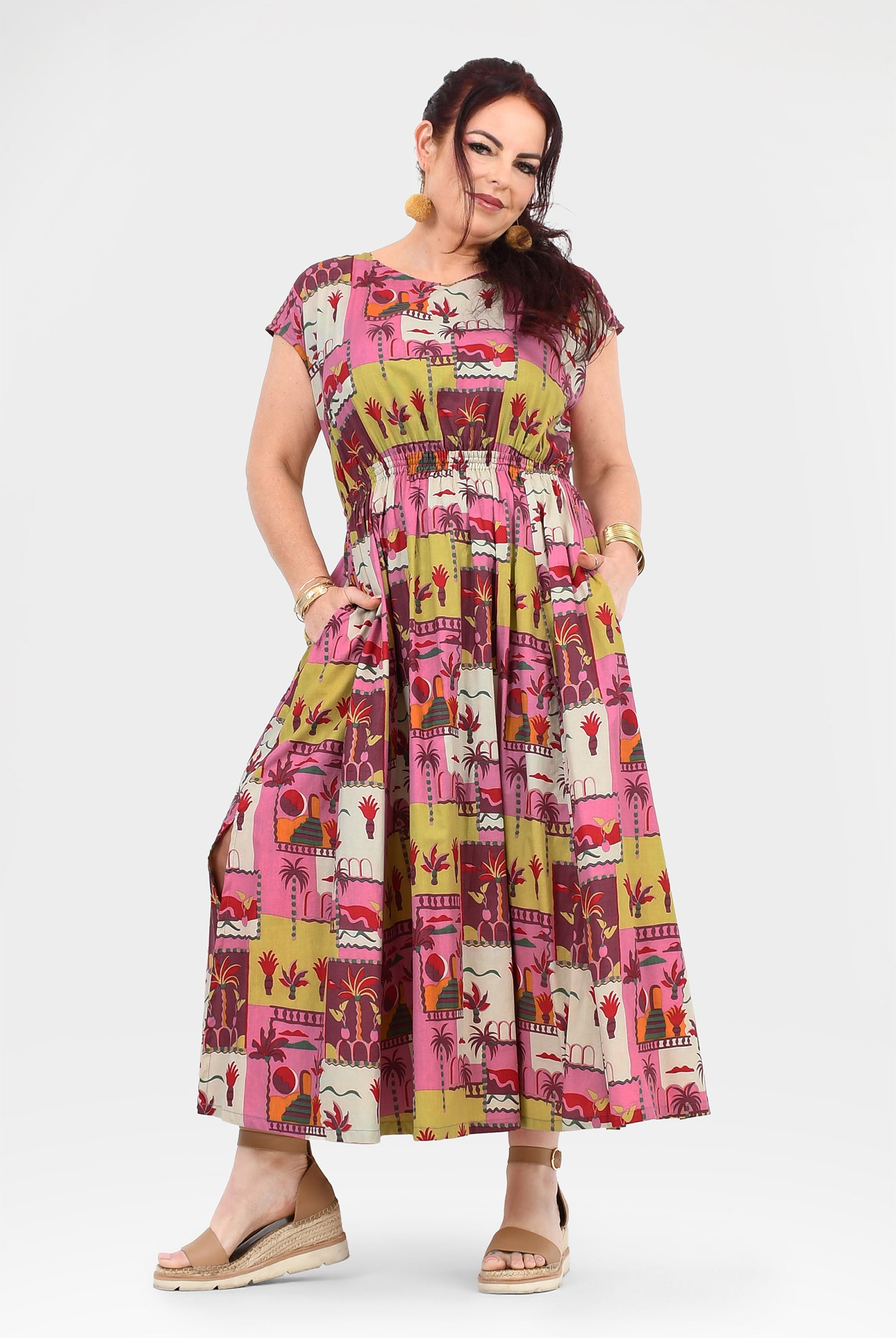Pink long dress with colorful animal-and-cactus print, short sleeves and gathered bodice