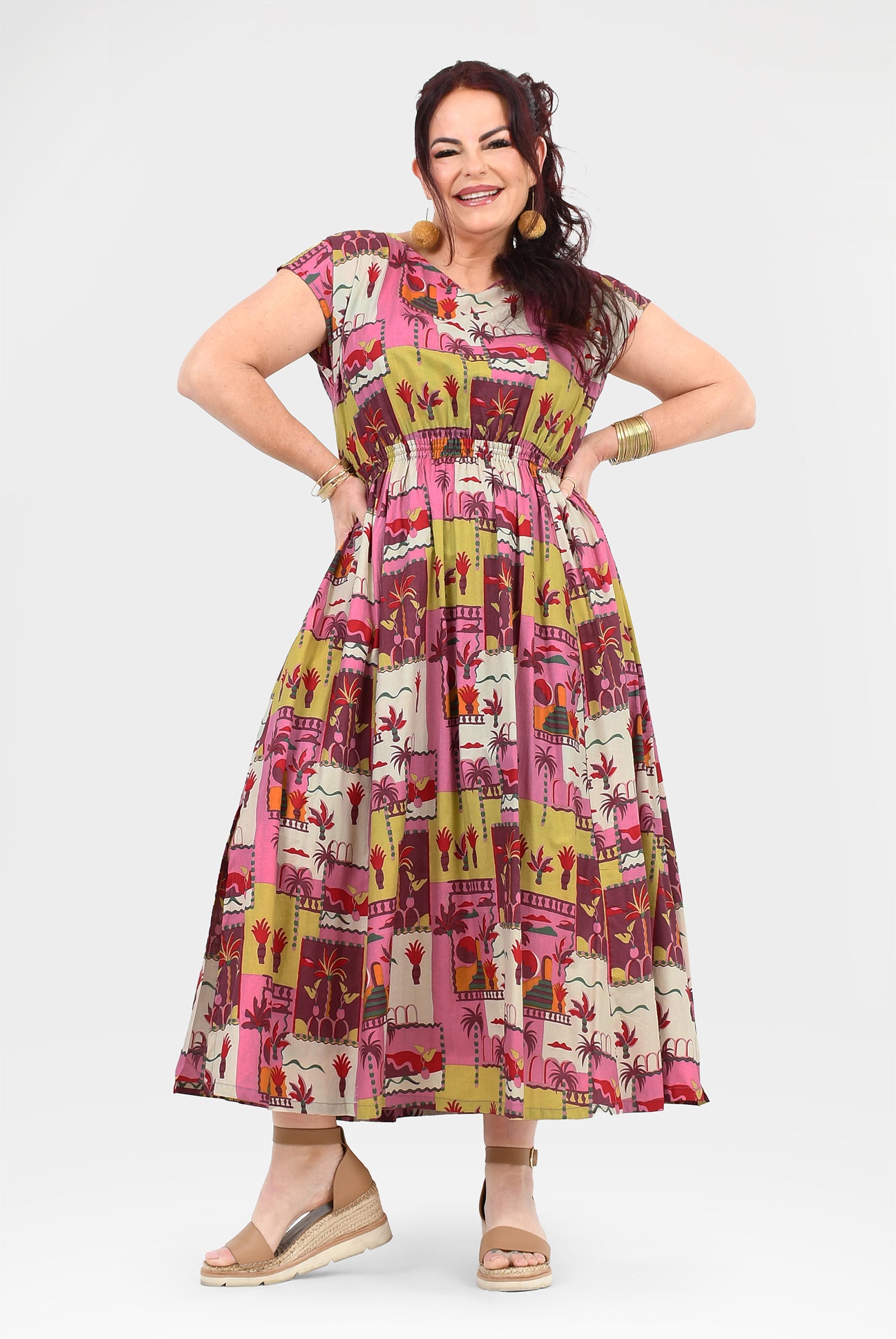 Pink long dress with colorful animal-and-cactus print, round neckline, midi-to-maxi length