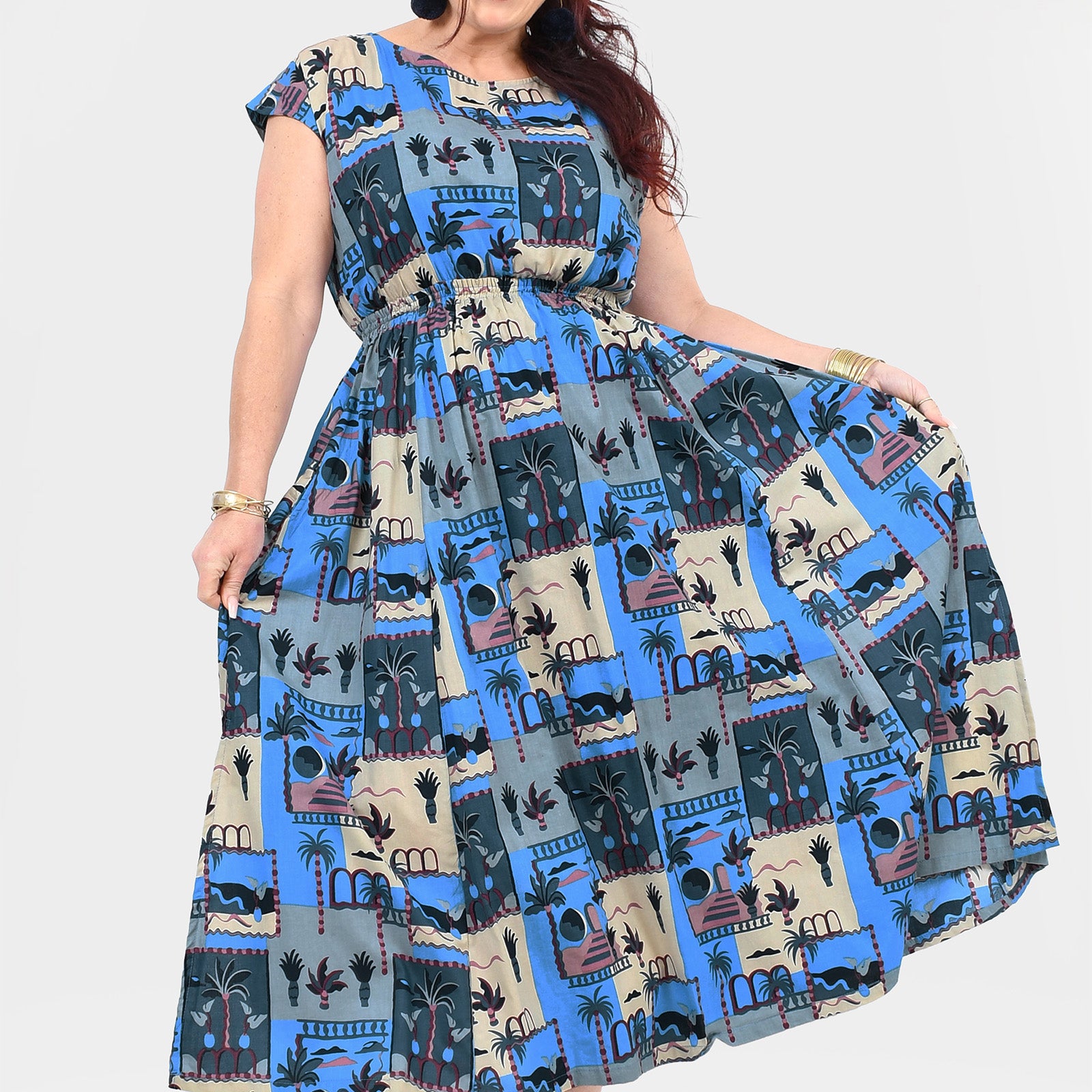 Blue and cream long dress with cap sleeves, gathered skirt, and illustrated skyline print