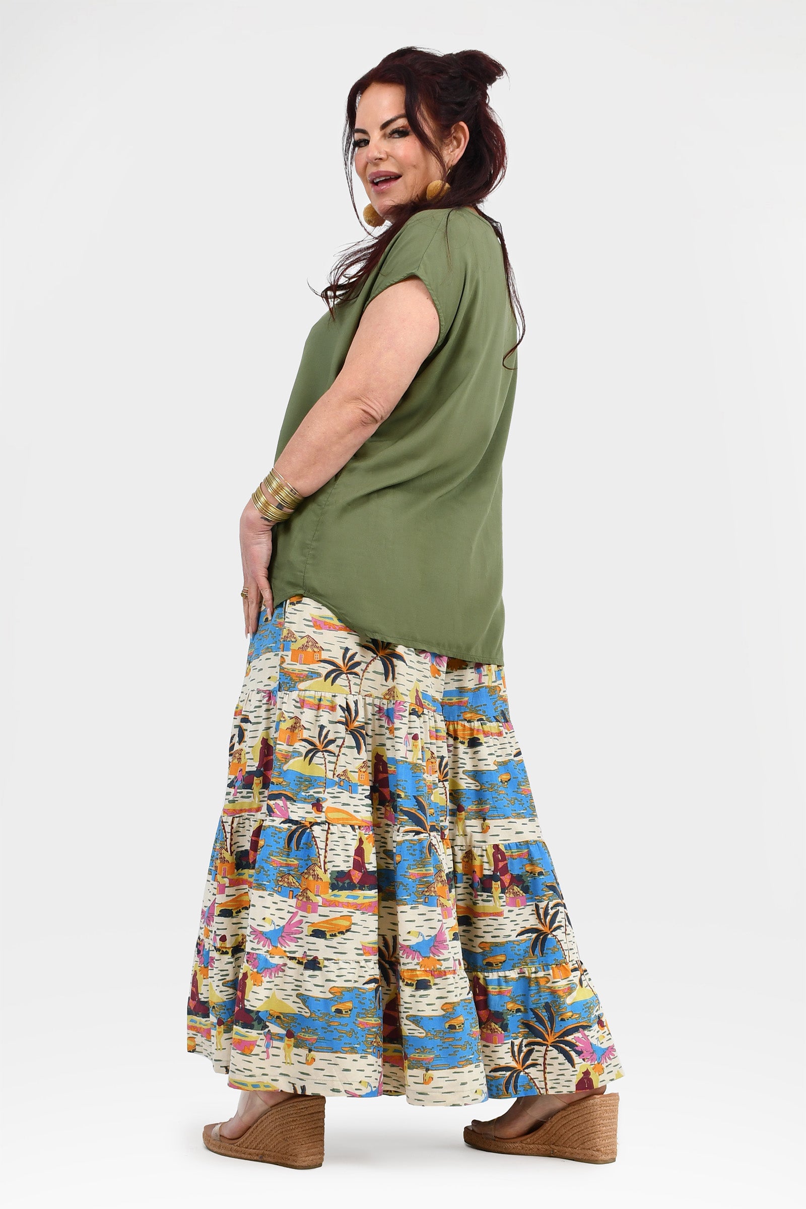 Flowy wide-leg pants with white base and blue-orange jungle print, elastic waistband