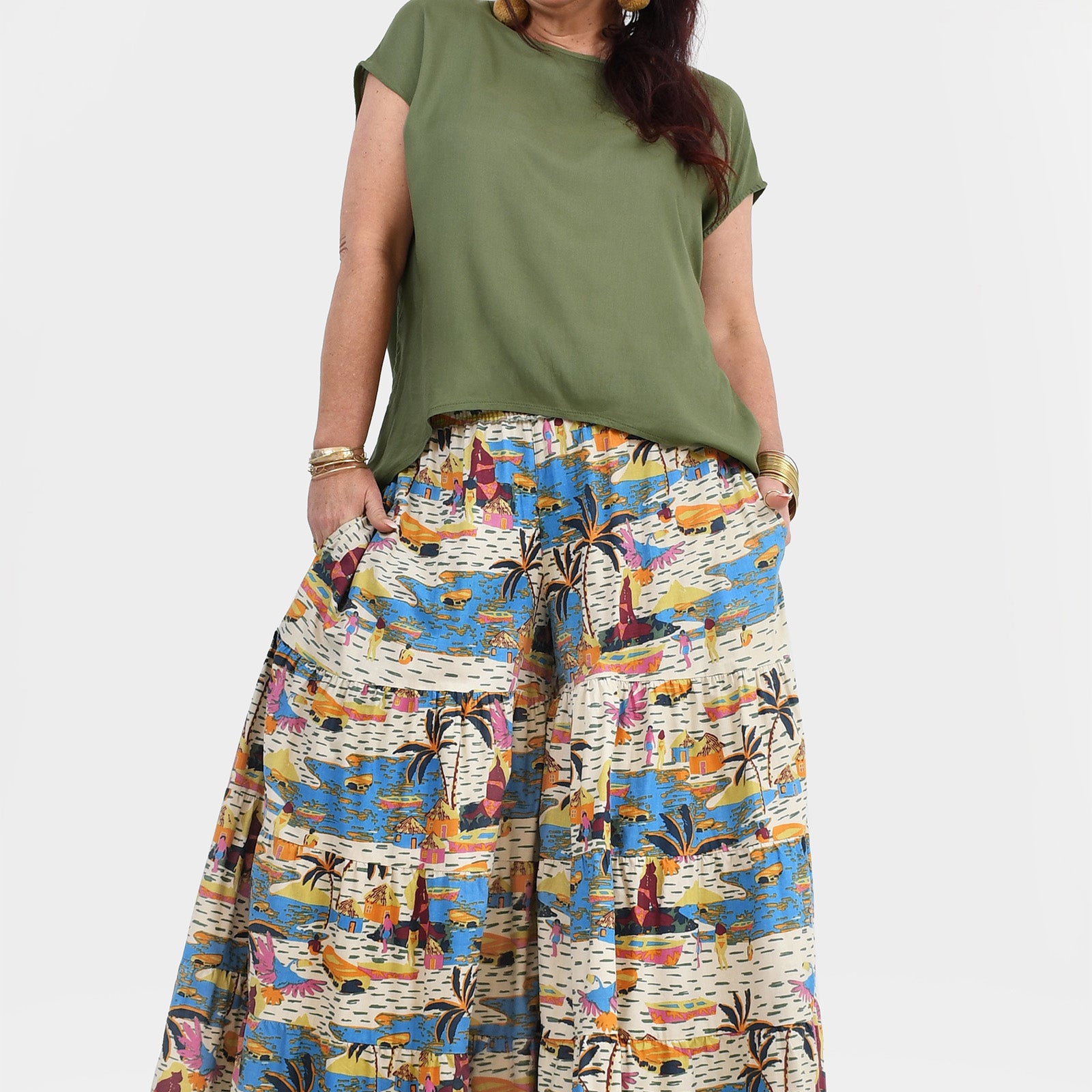 Wide-leg printed pants in white, blue, and orange with elastic waist and gathered drape