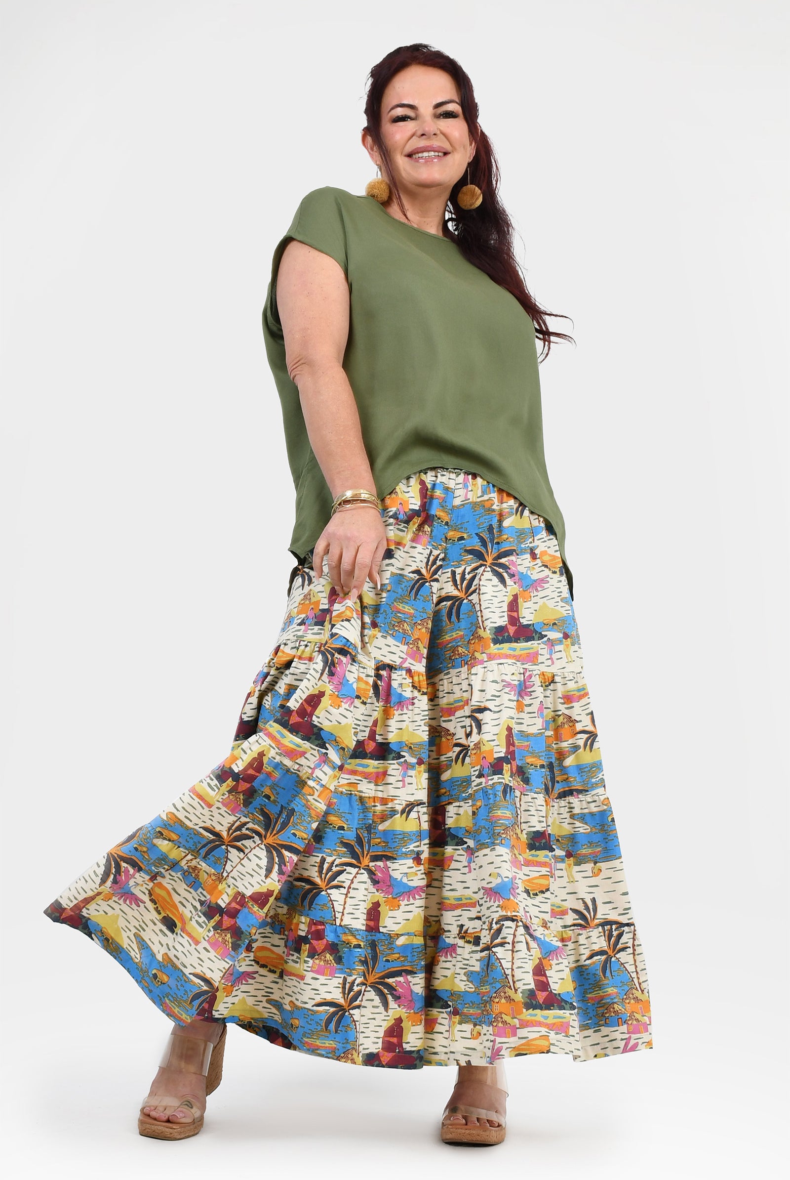 Printed wide-leg pants with elastic waistband; white, blue, and orange tropical artwork