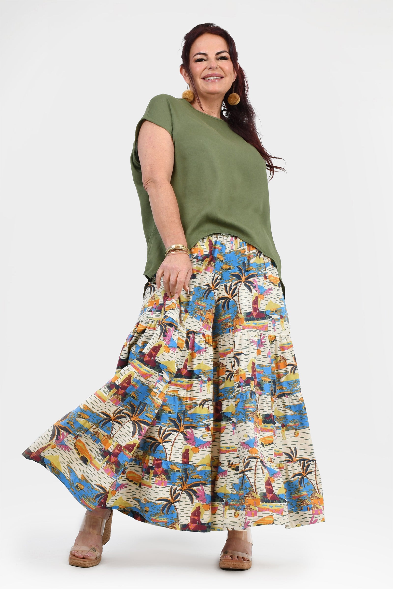 Printed wide-leg pants with elastic waistband; white, blue, and orange tropical artwork