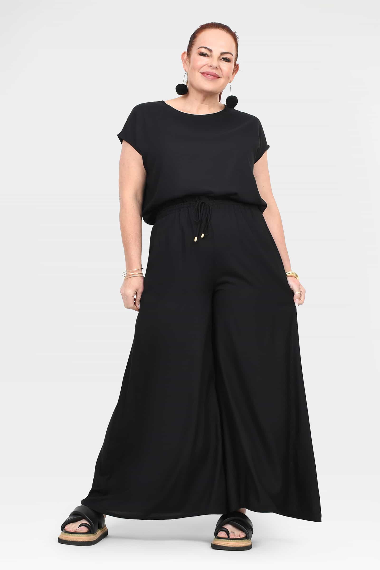 Black wide-leg pants; gathered elastic waist and wide, softly pleated leg openings