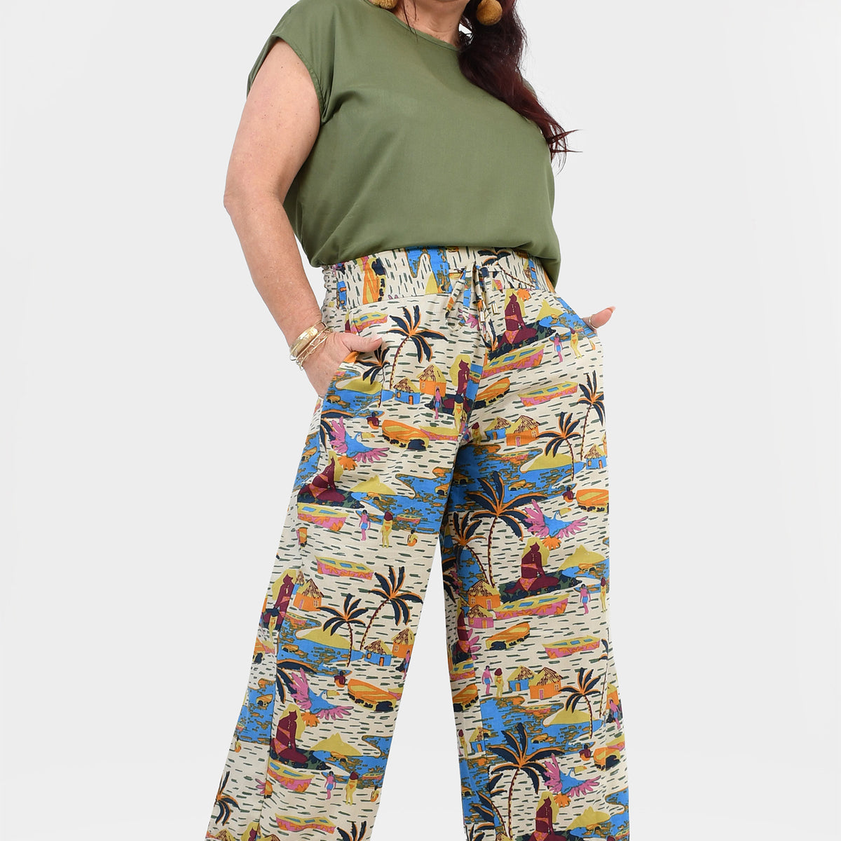 Printed wide-leg pants, off-white base with vibrant abstract jungle print