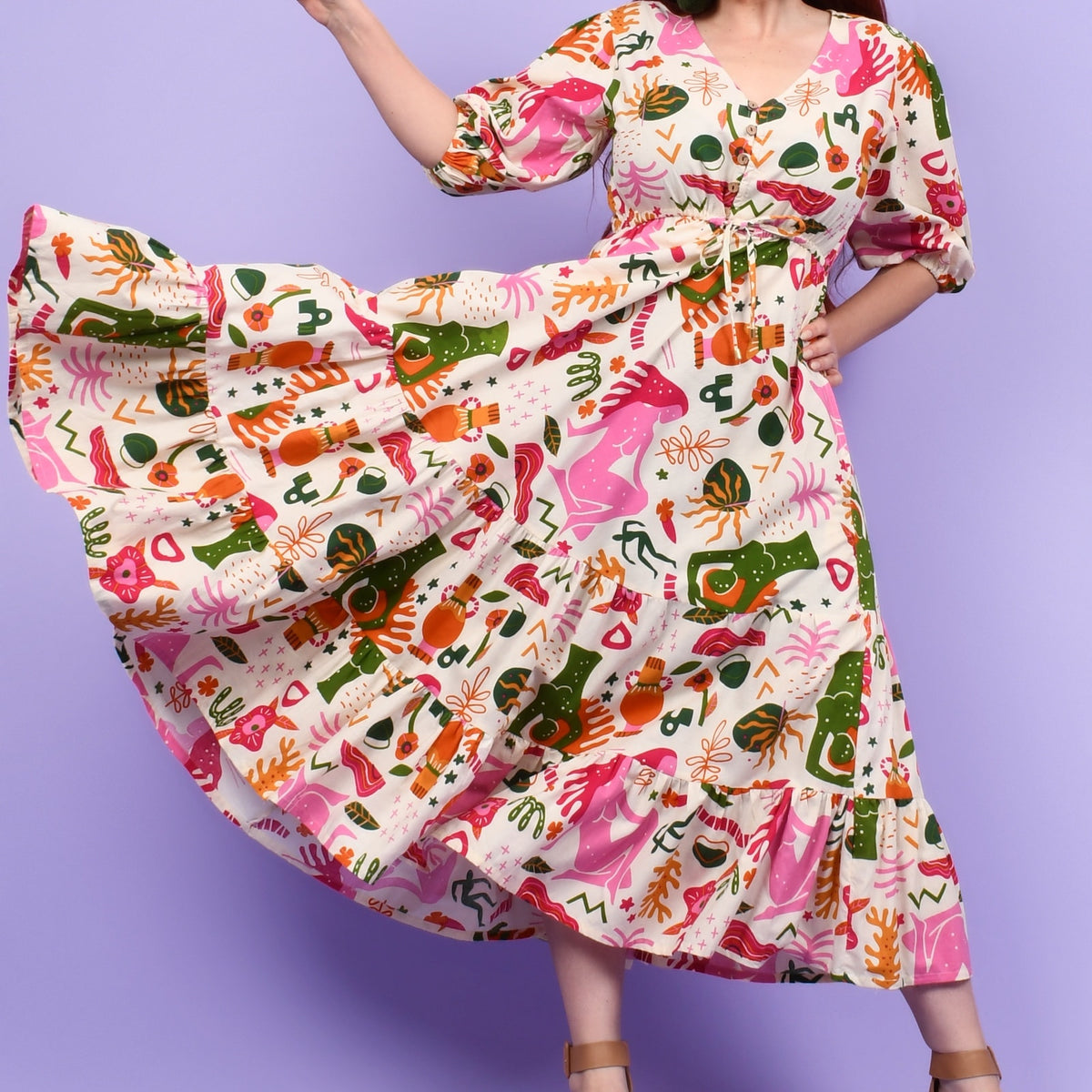 Colorful animal-print midi dress with gathered waist and fluttery tiered skirt