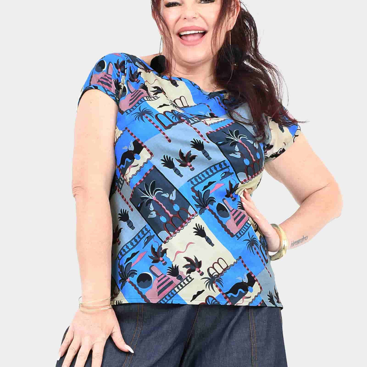 Graphic tee with blue-and-cream island pattern, fitted short-sleeve crew neck