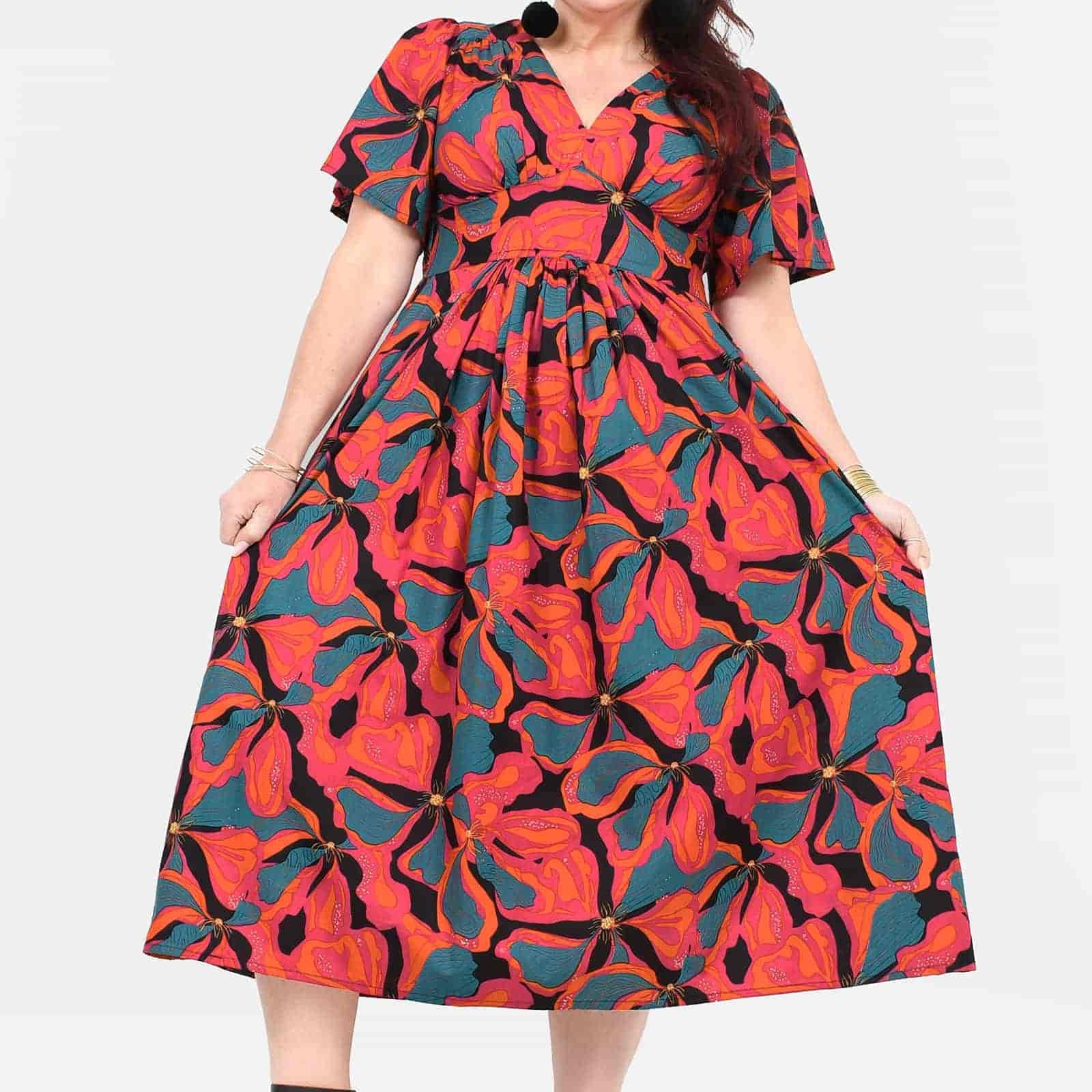 Midi dress with short sleeves, V-neck, gathered waist, and vivid floral abstract pattern