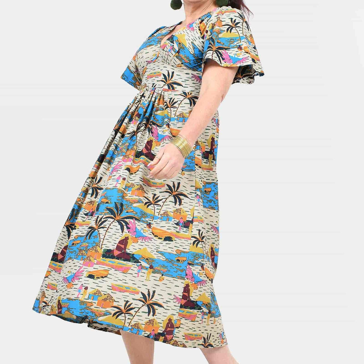 Side view of colorful printed midi dress with V-neck and short flutter sleeves