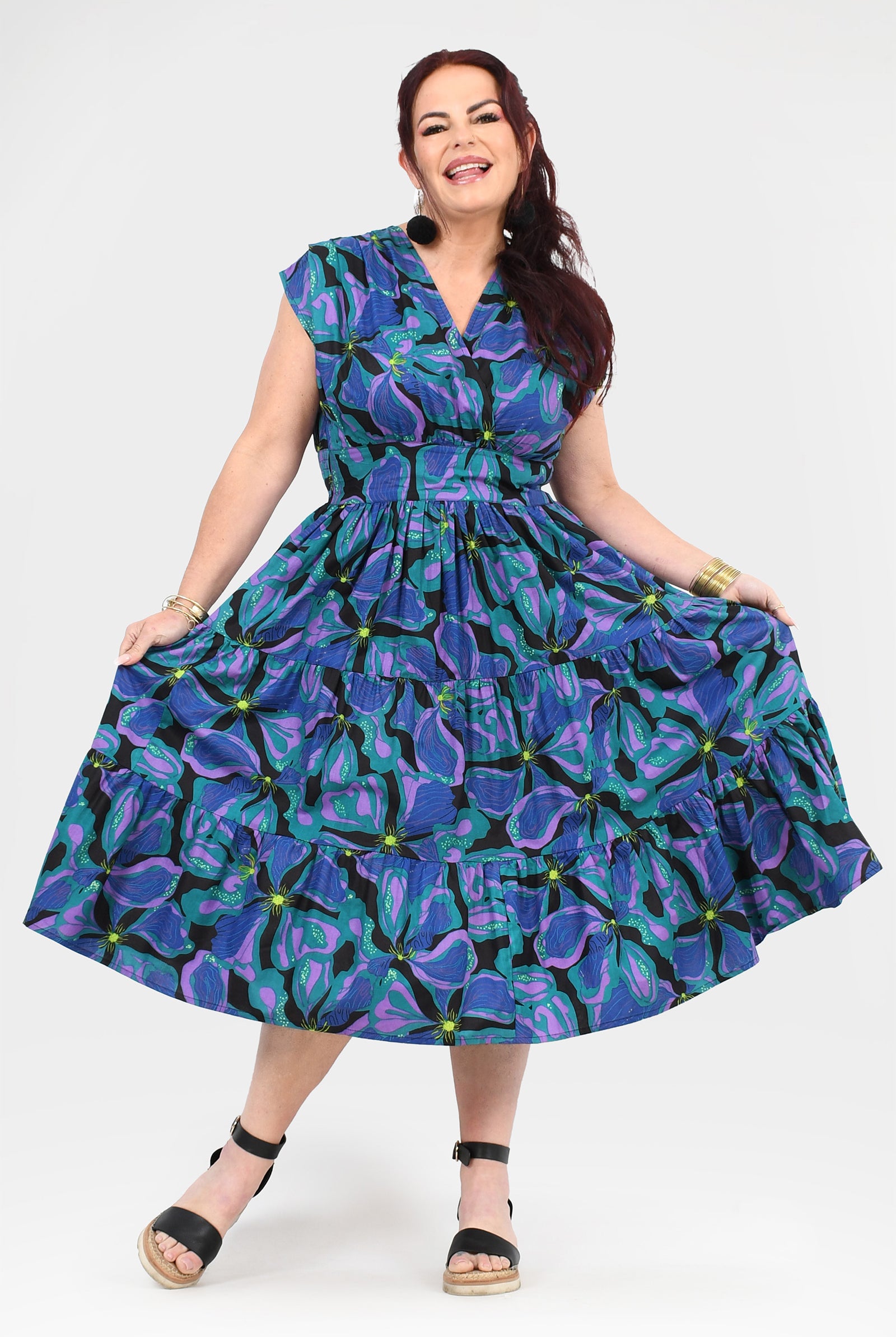 Printed teal and purple midi dress with cap sleeves and tiered ruffle skirt