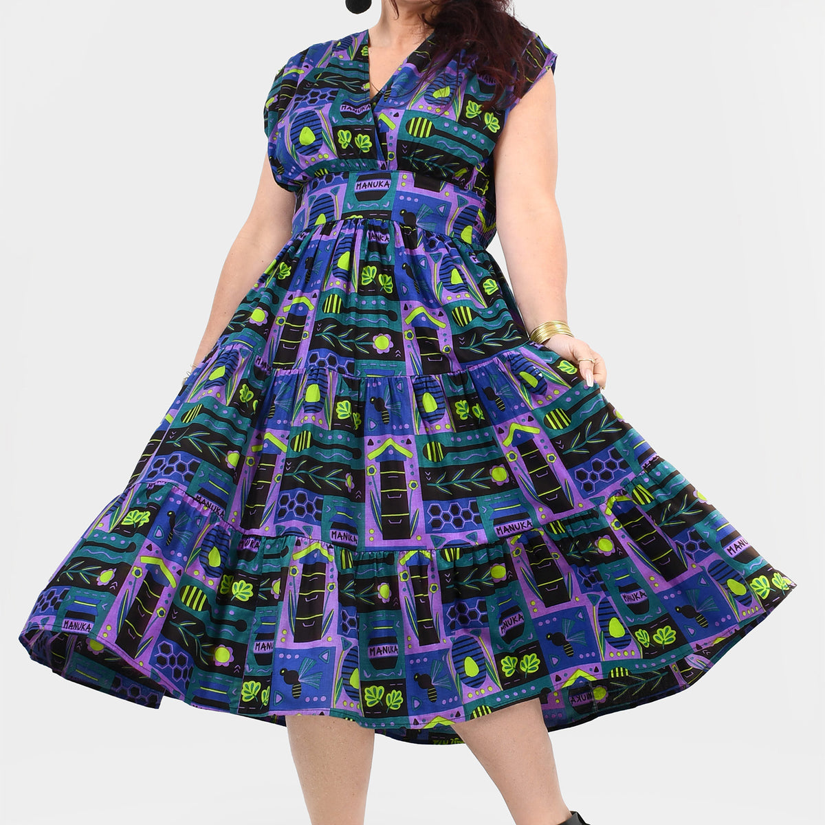 Multicolor printed midi dress, sleeveless with full pleated skirt, side view