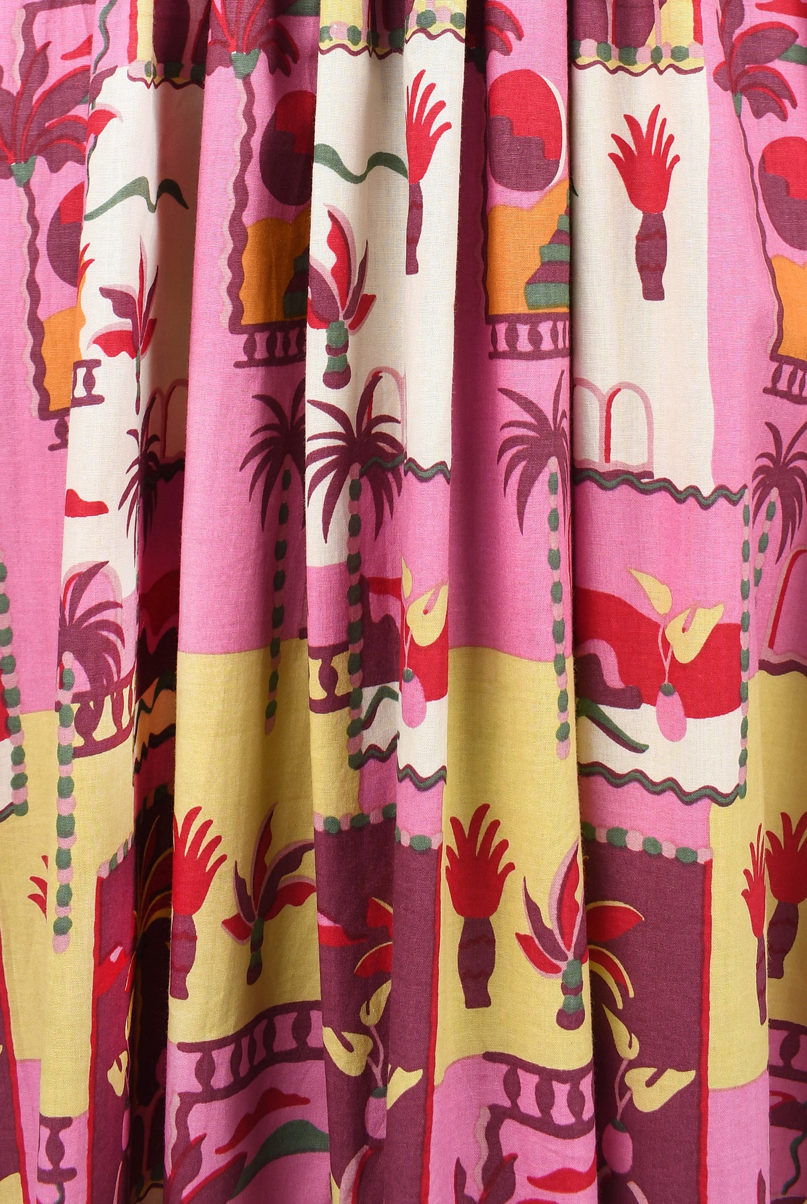 Close-up: pink long dress fabric with colorful animal, hand, and cactus print
