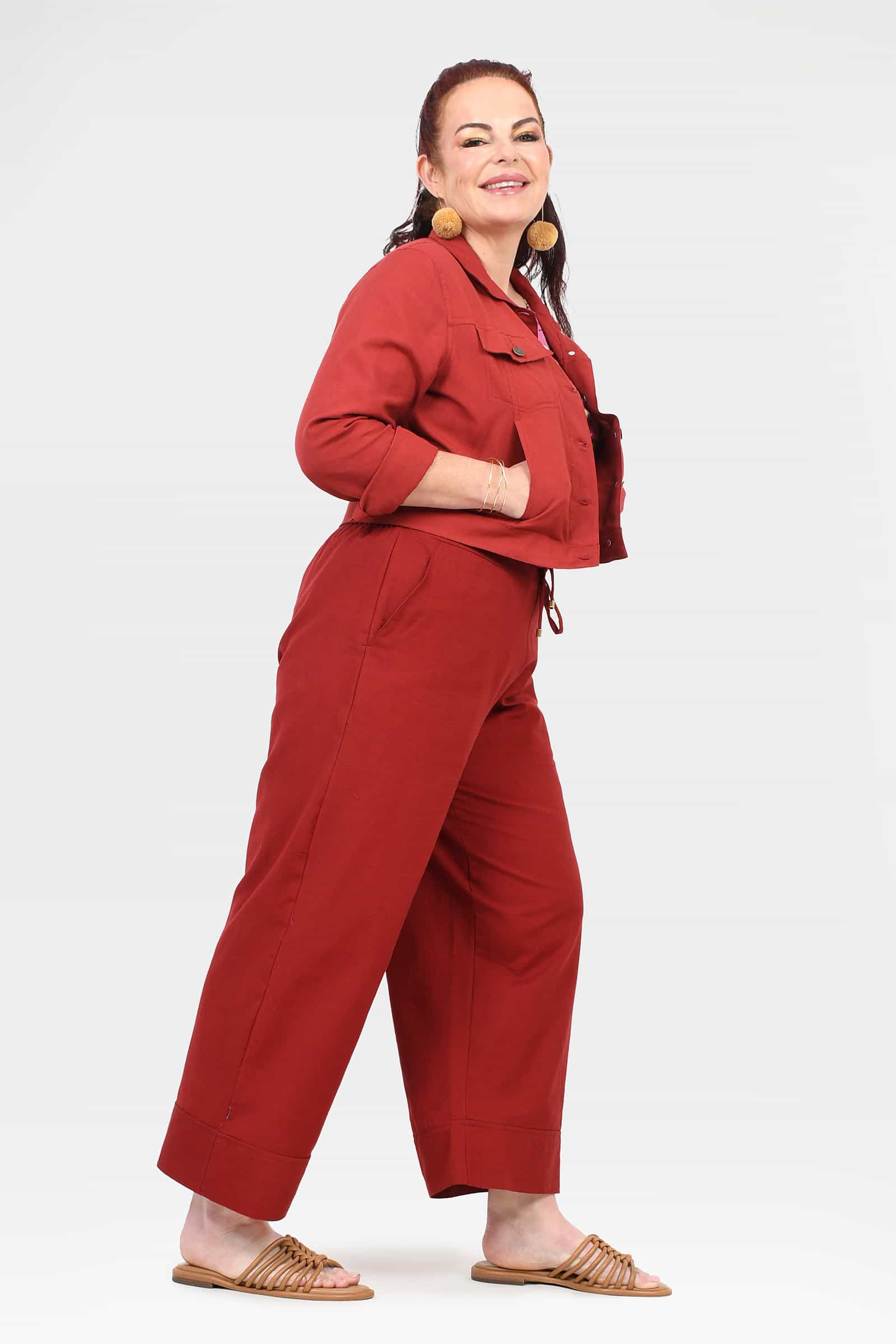 Dark red wide-leg cropped pants with buttoned front and drawstring waist
