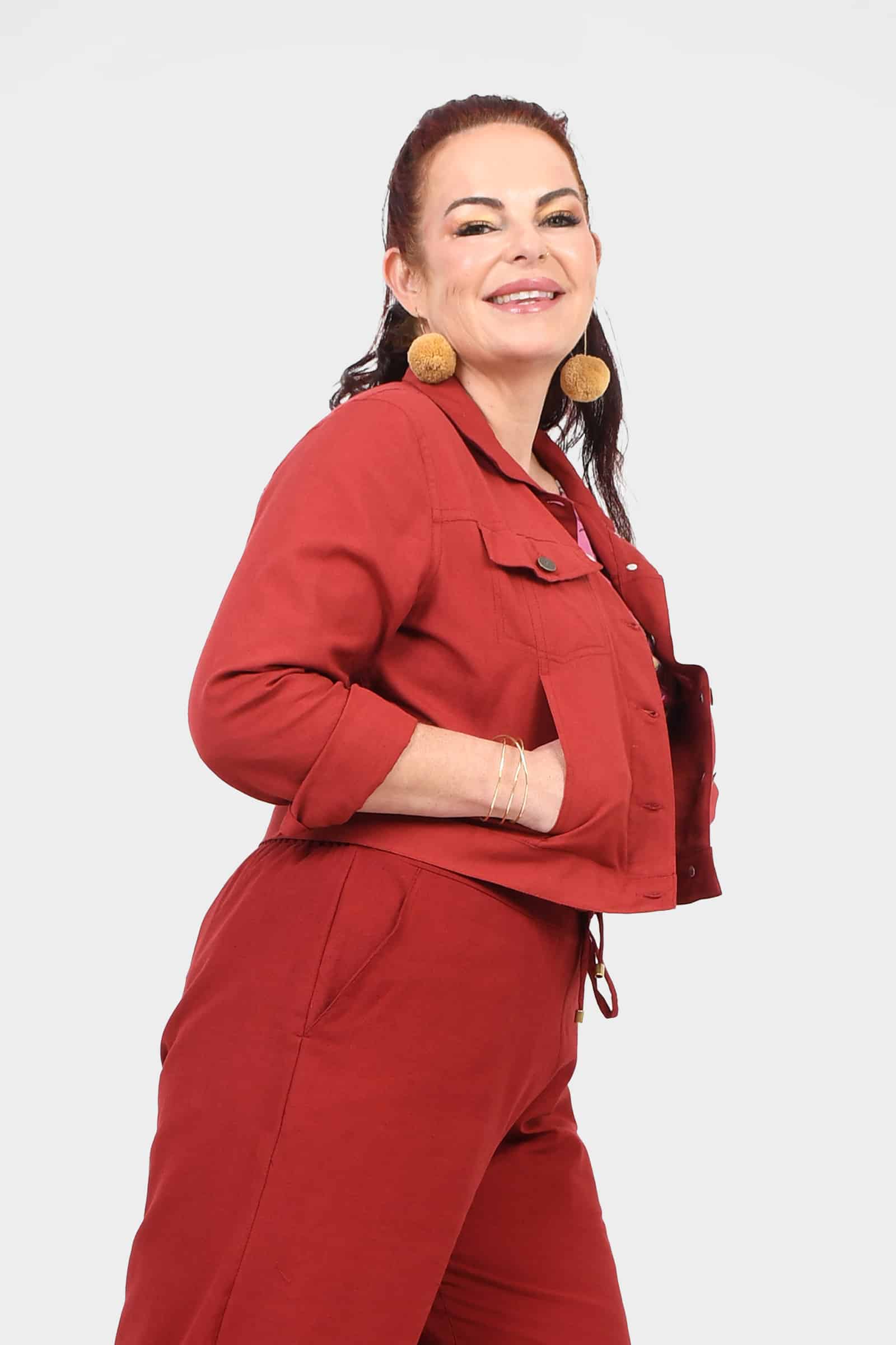 Dark red cropped jacket with pointed collar, button closure, and flap pockets