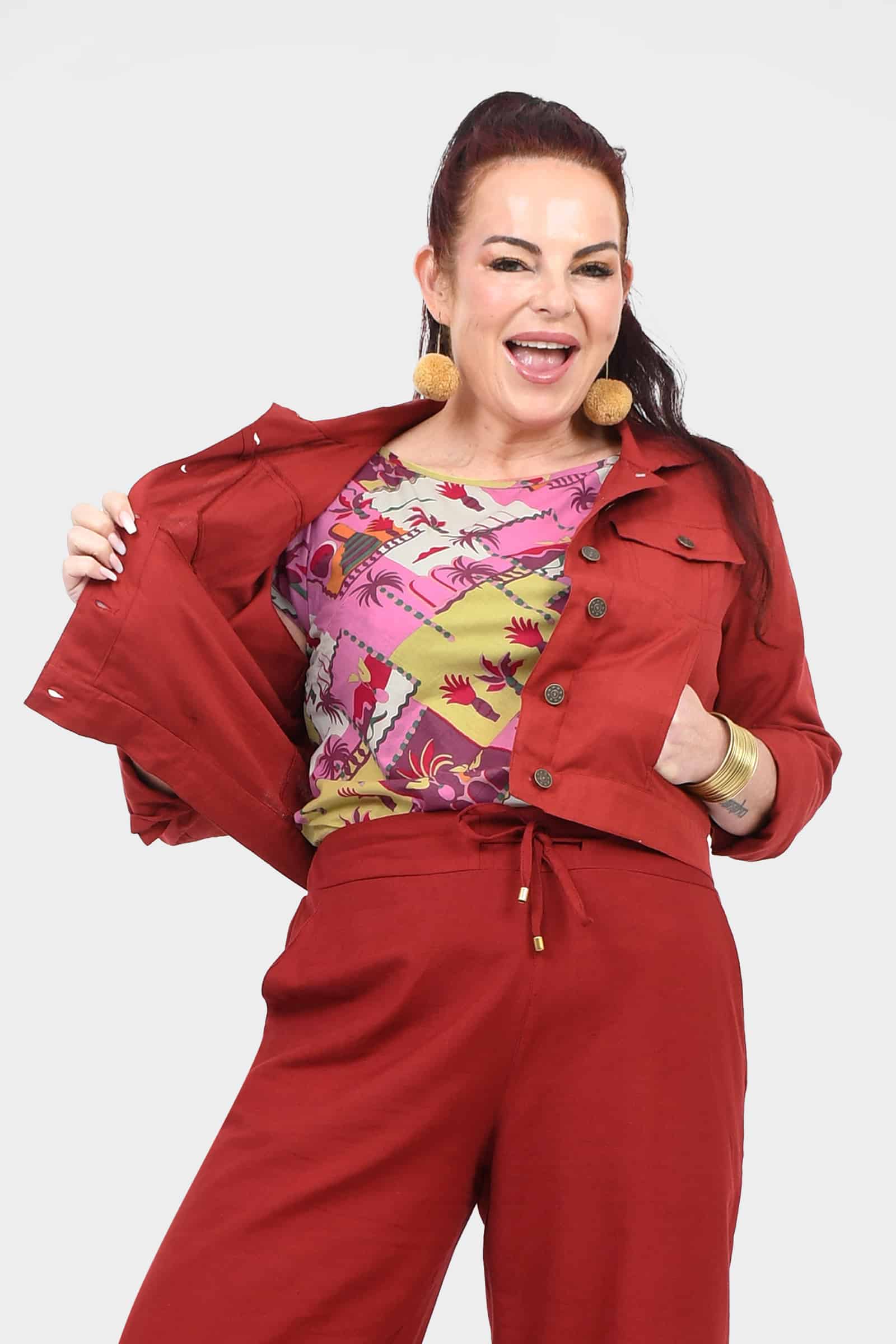 Dark red jacket with button front, flap chest pockets, and pointed collar