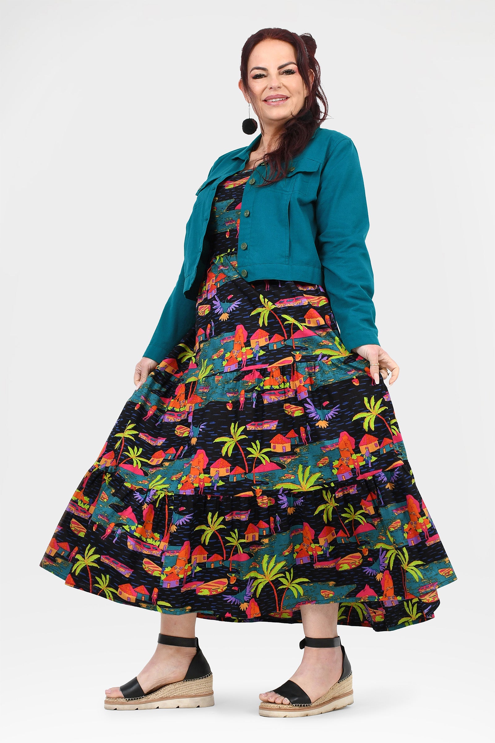 Teal maxi dress with tropical multicolor print and fitted bodice, gold buttons