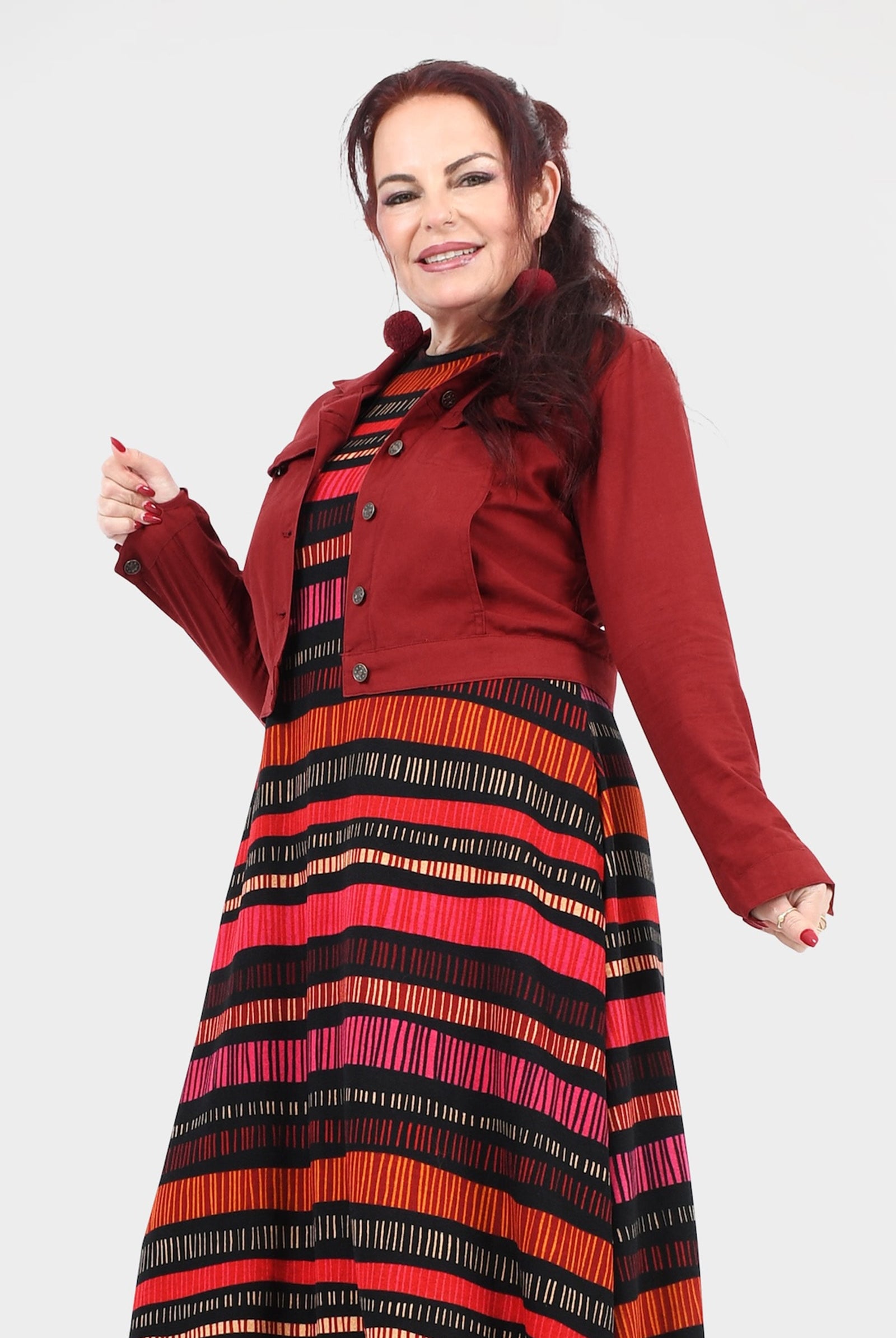 Dark red button-front jacket with pointed collar and chest pockets, side view