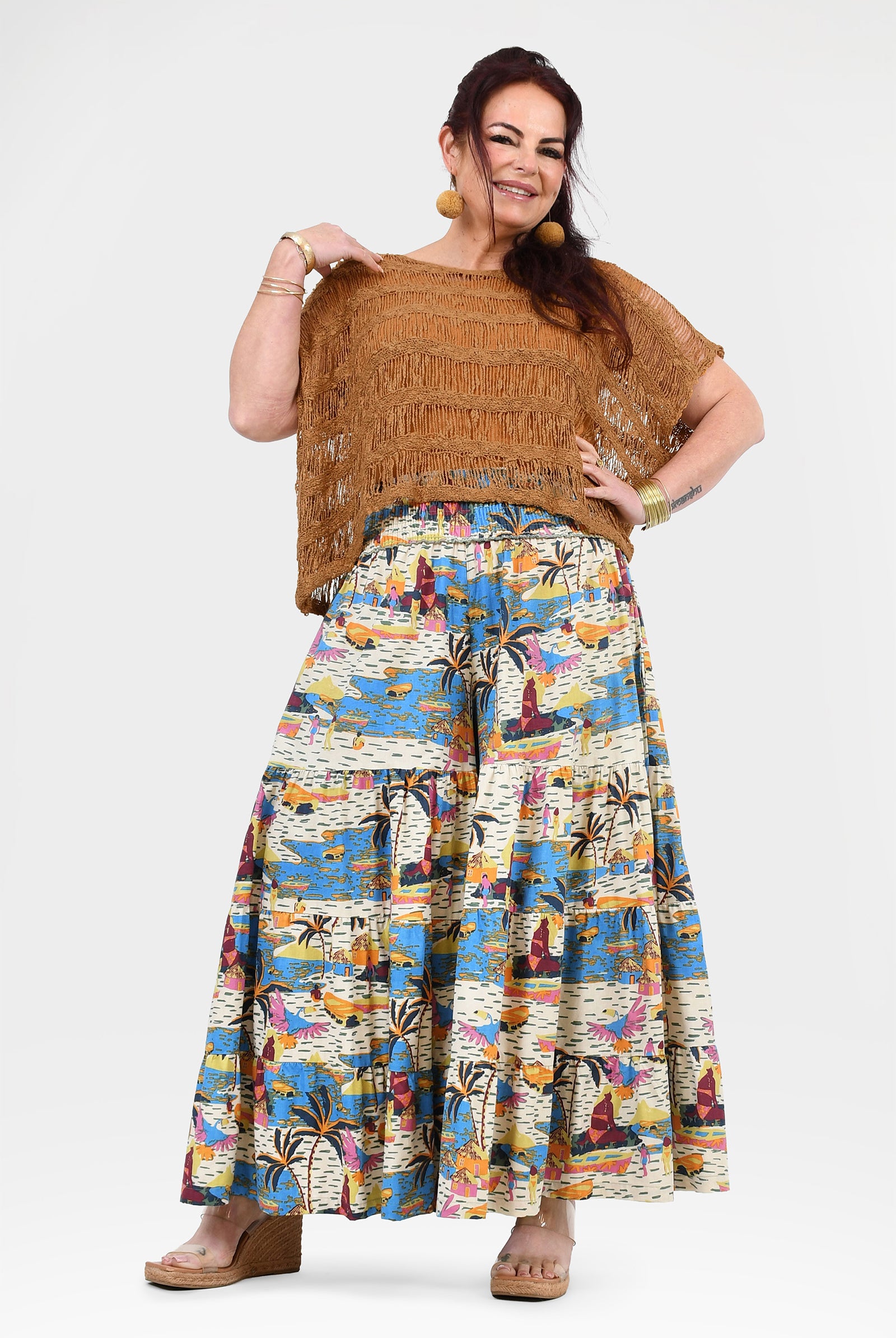 Wide-leg printed pants with white base and blue-orange jungle pattern, elastic waist