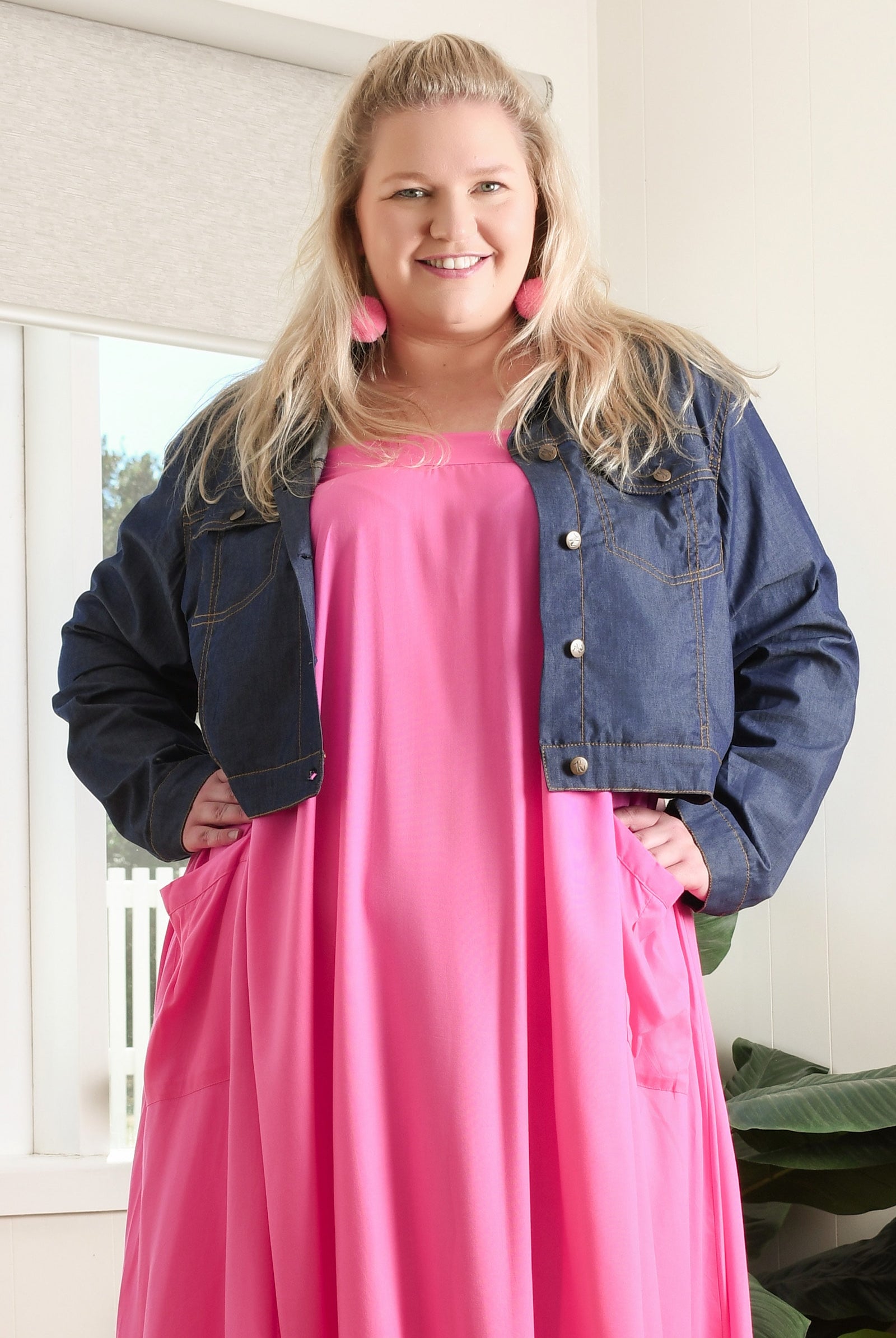 Dark blue denim jacket with snap buttons, flap chest pockets, and long sleeves