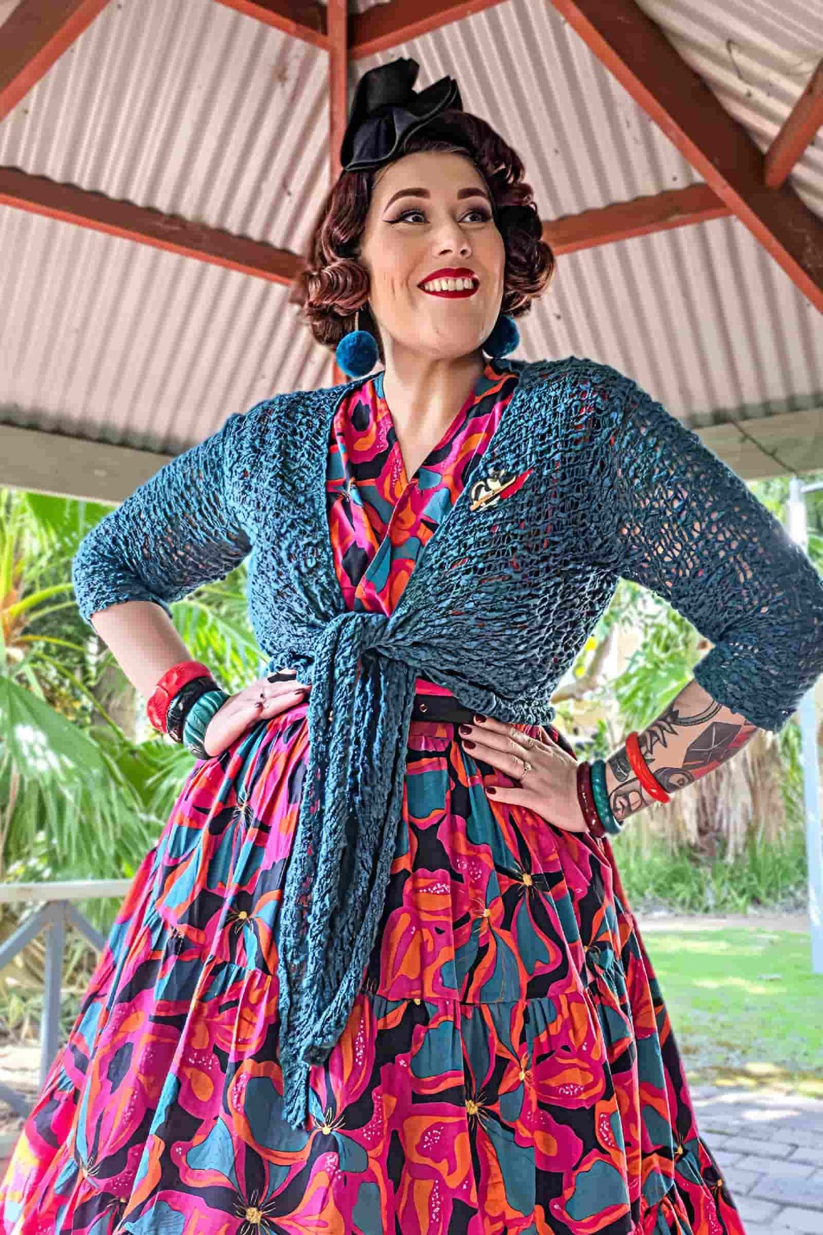 Teal popcorn-knit jacket with front tie, open V neckline