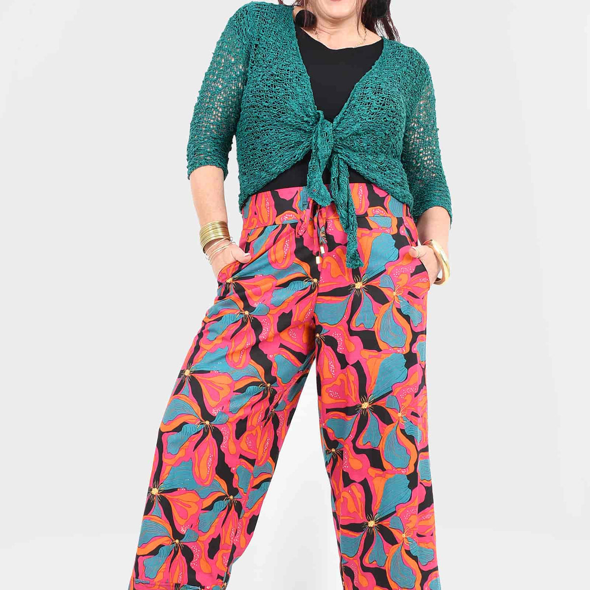 Wide-leg pants with pink, teal, and purple leaf print