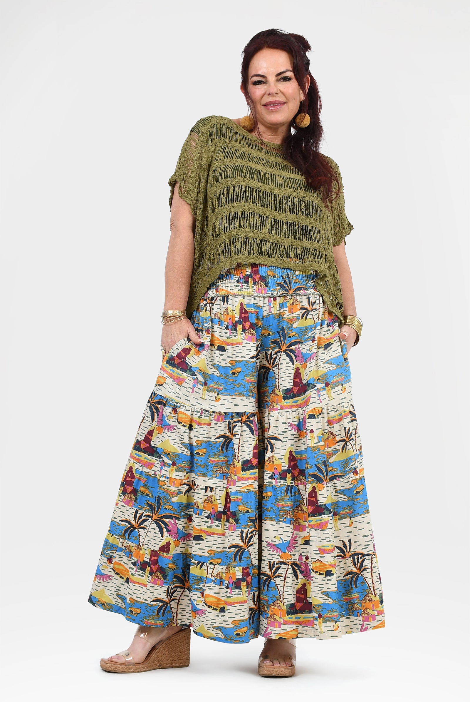 White and multicolor jungle print wide-leg pants with elastic waistband, wide flowing legs