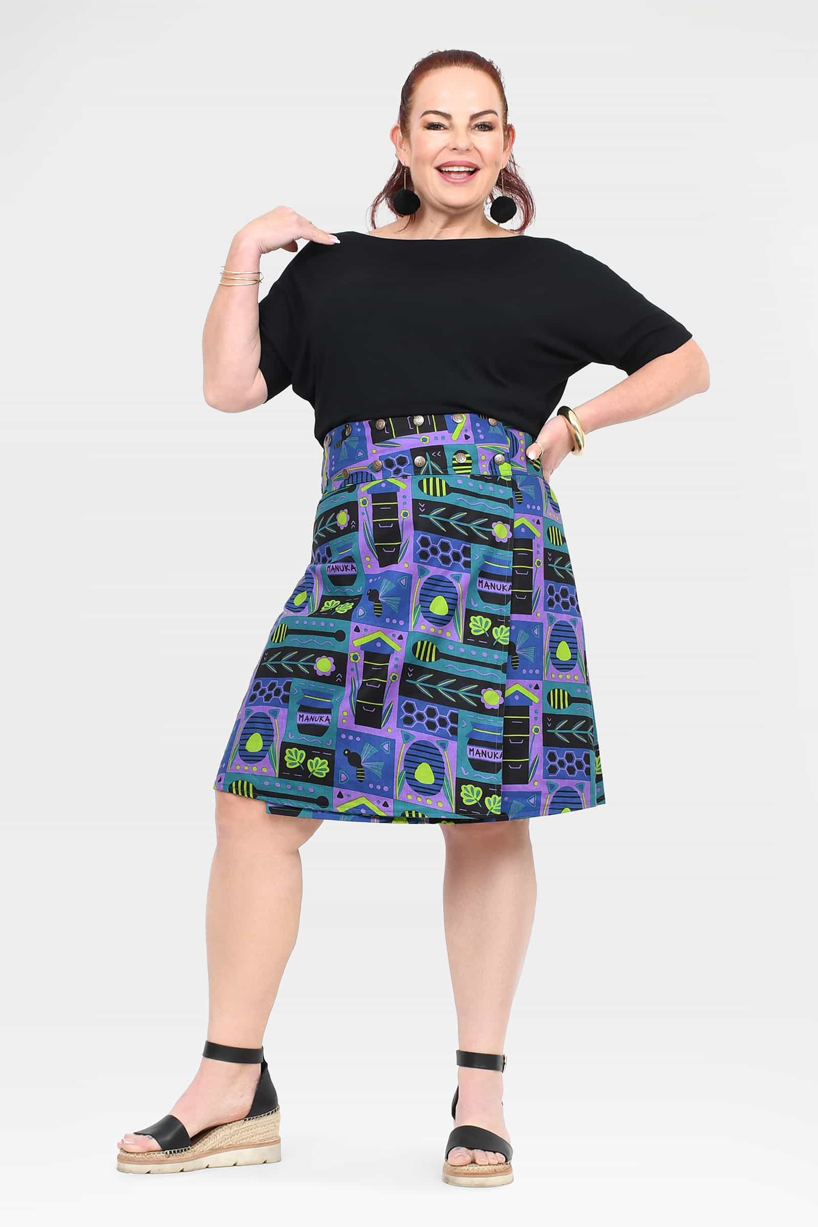 Reversible button skirt, black top with colorful pattern panels, knee length