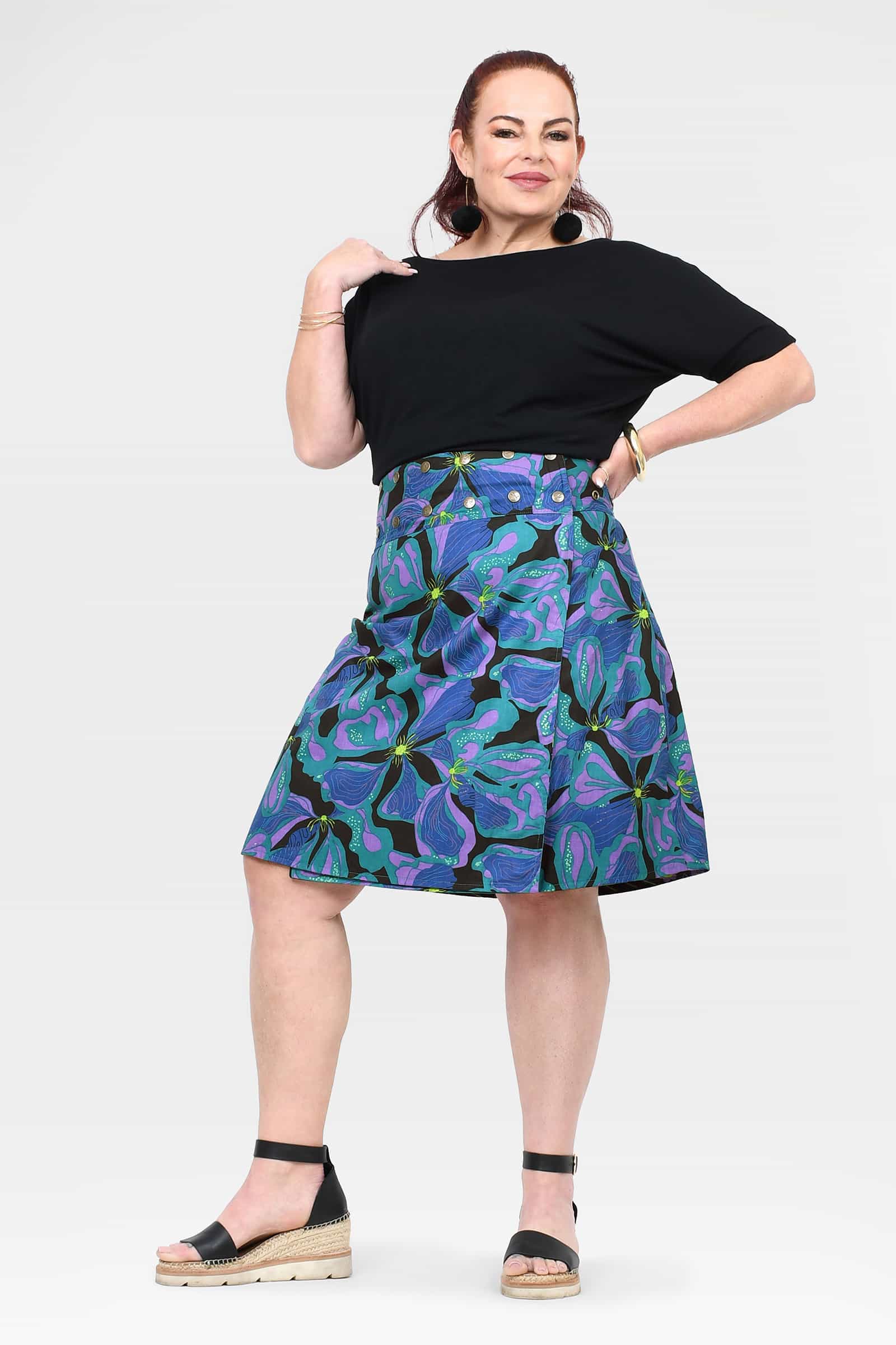Reversible button skirt, black top with teal and purple swirling print, flared hem