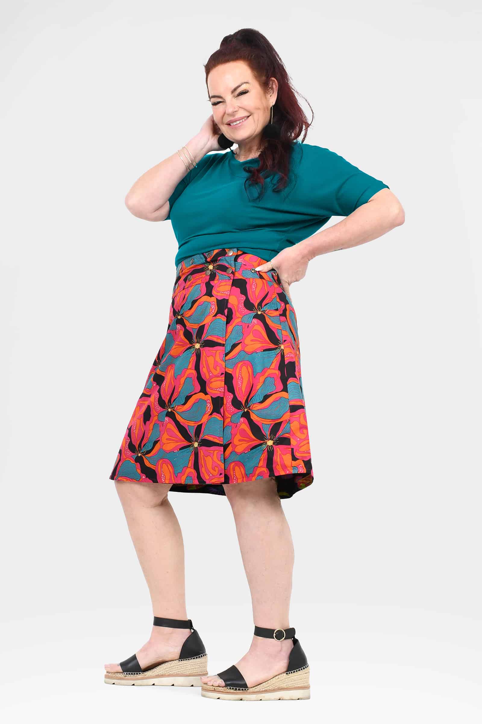 Above-knee flared A-line skirt with multicolor abstract floral print and dark trim