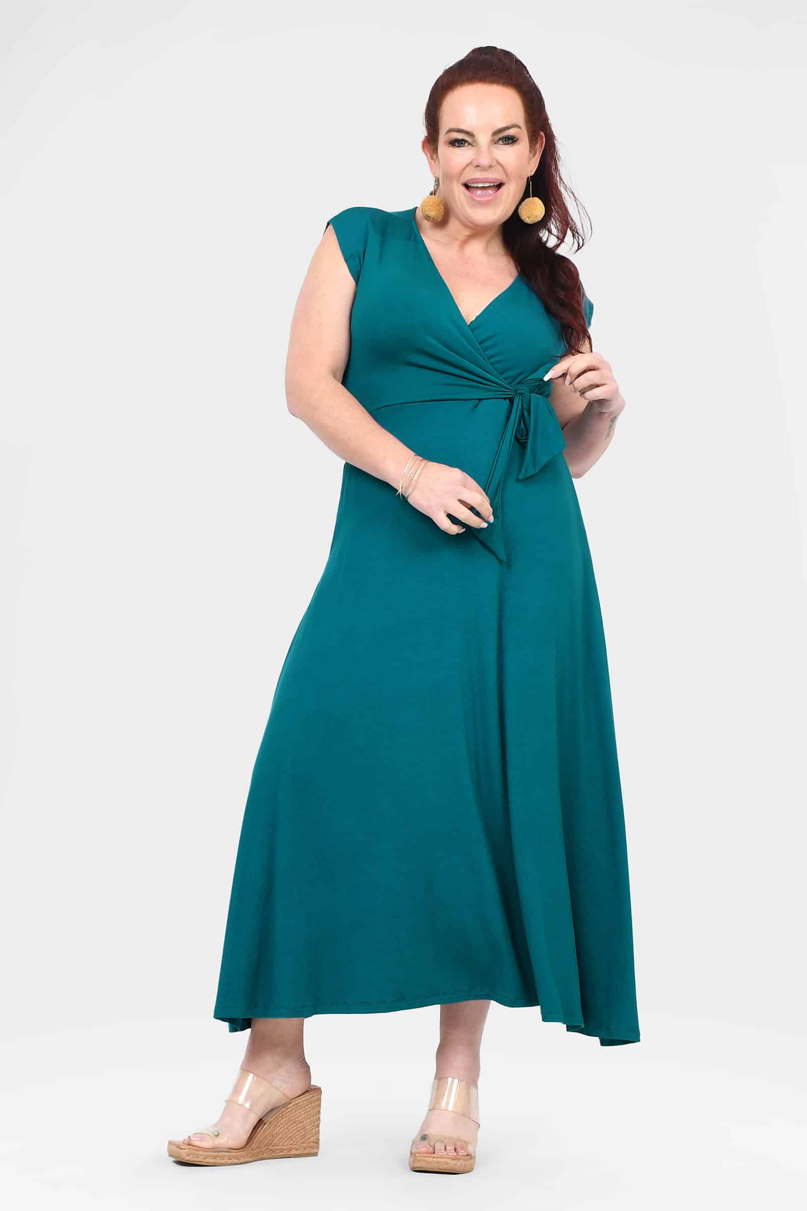 Dark teal sleeveless V-neck midi dress with ruched tie waist and A-line skirt