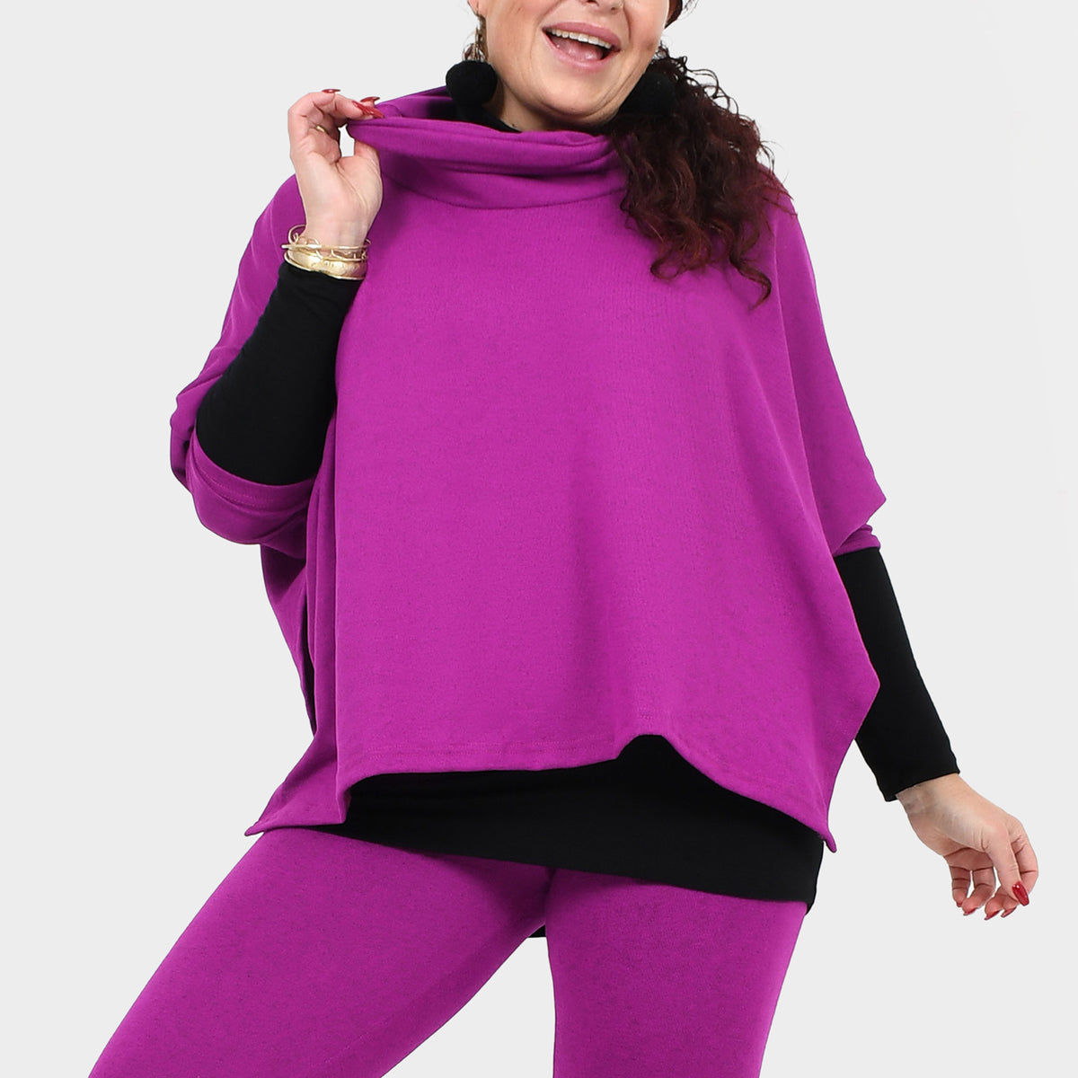Magenta draped over top with cowl neckline and asymmetric hem over leggings