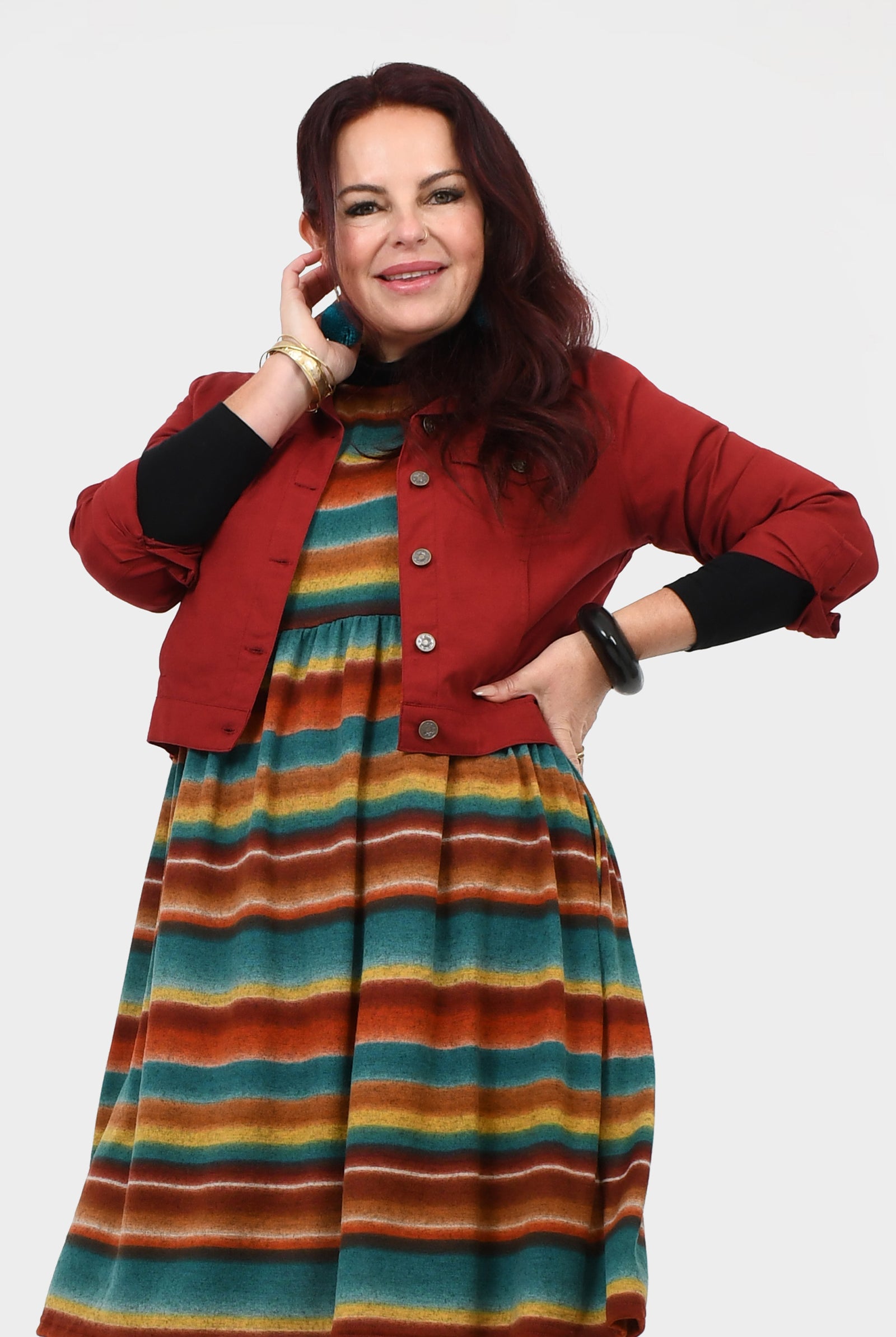 Dark red jacket with front button placket and flap pockets, long sleeves