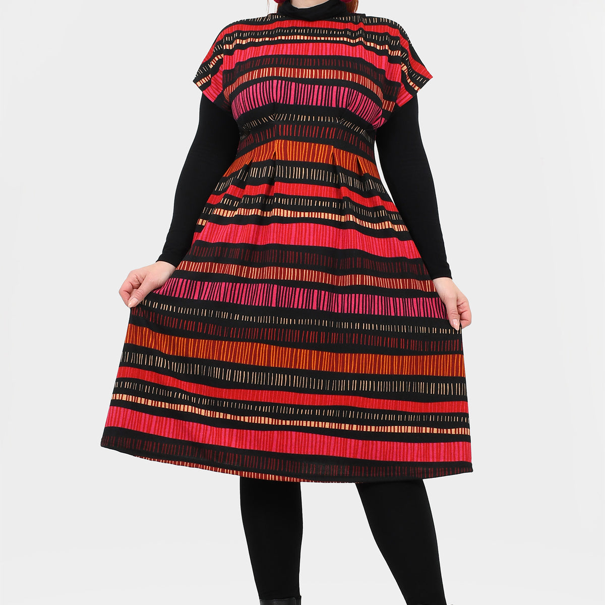 Fia dress front view with black high neck and bold red/pink/orange striped full skirt