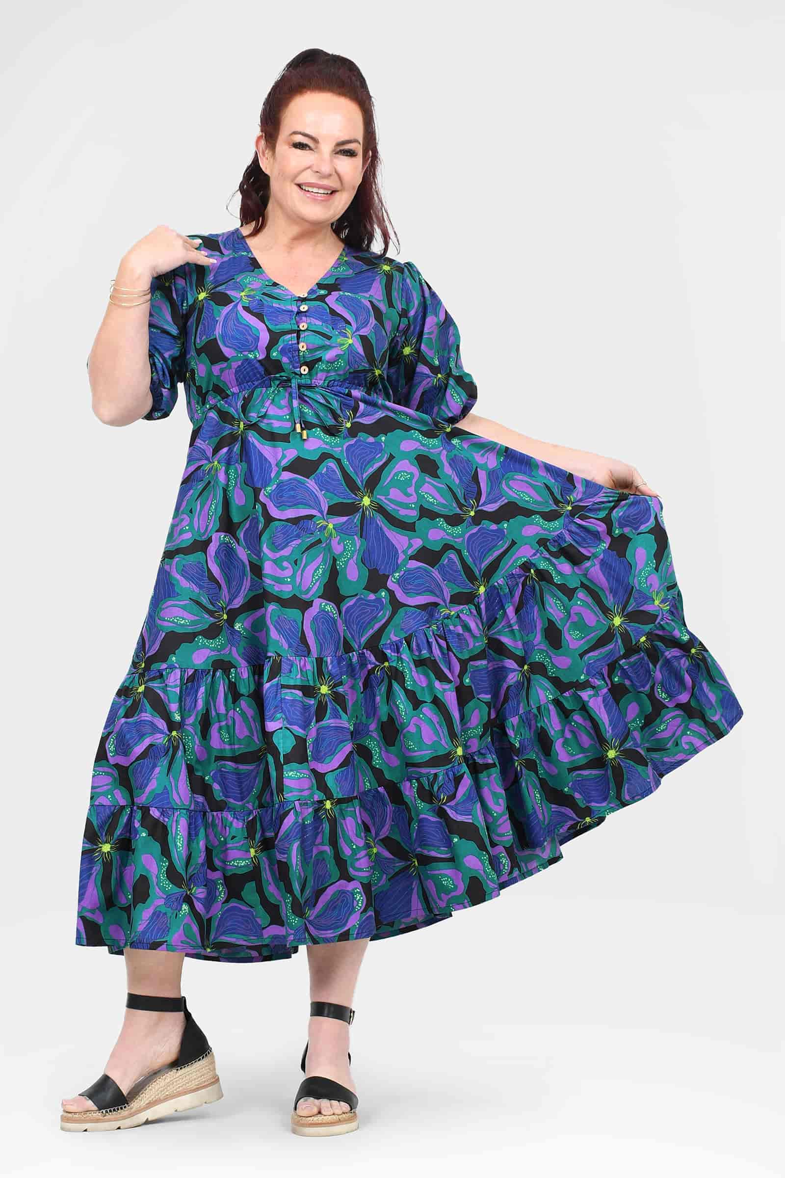 Teal midi dress with purple leaf pattern, button V-neck and tiered ruffle skirt, puff sleeves