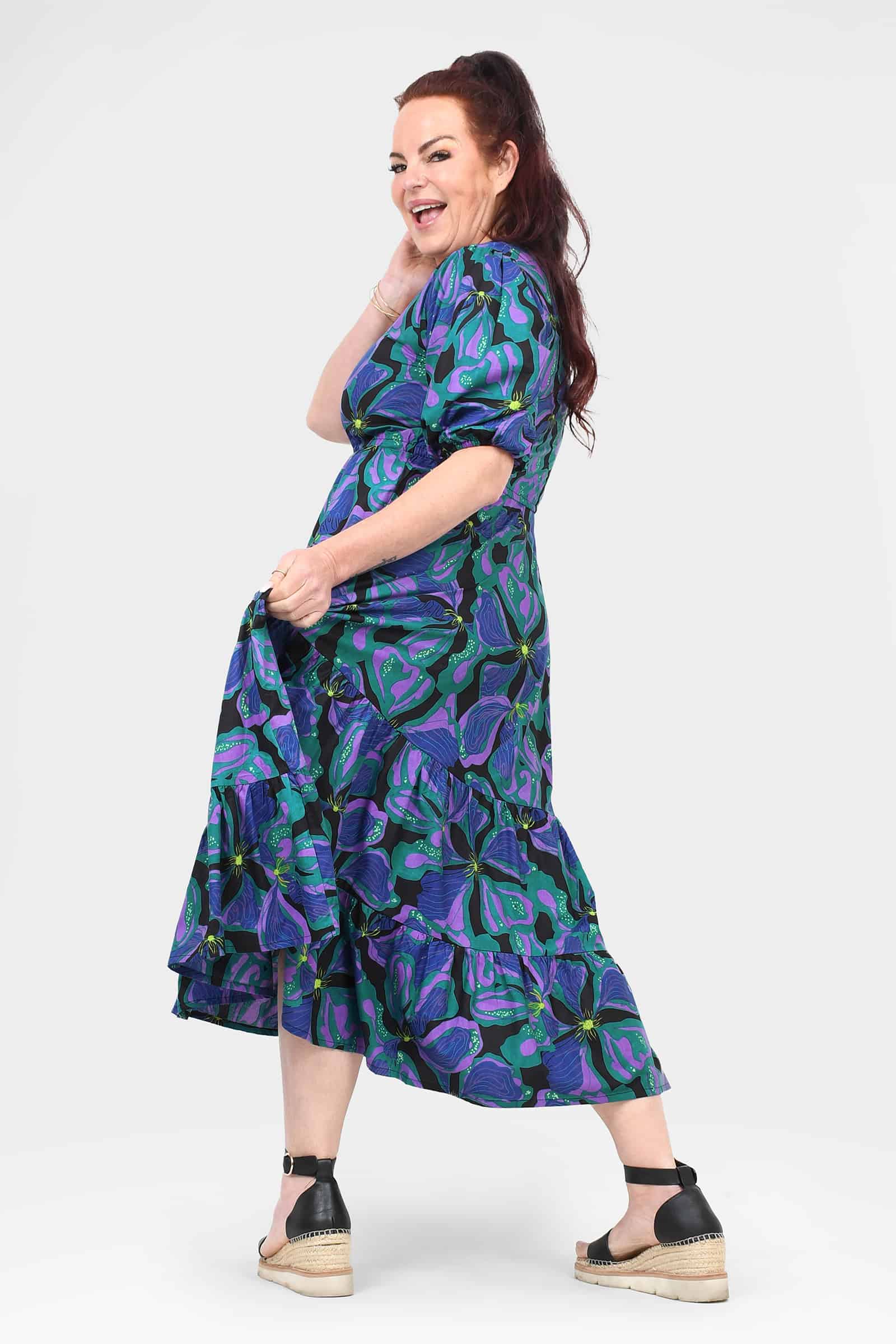 Teal-and-purple patterned midi dress, puff sleeves, button front V-neck, tiered skirt