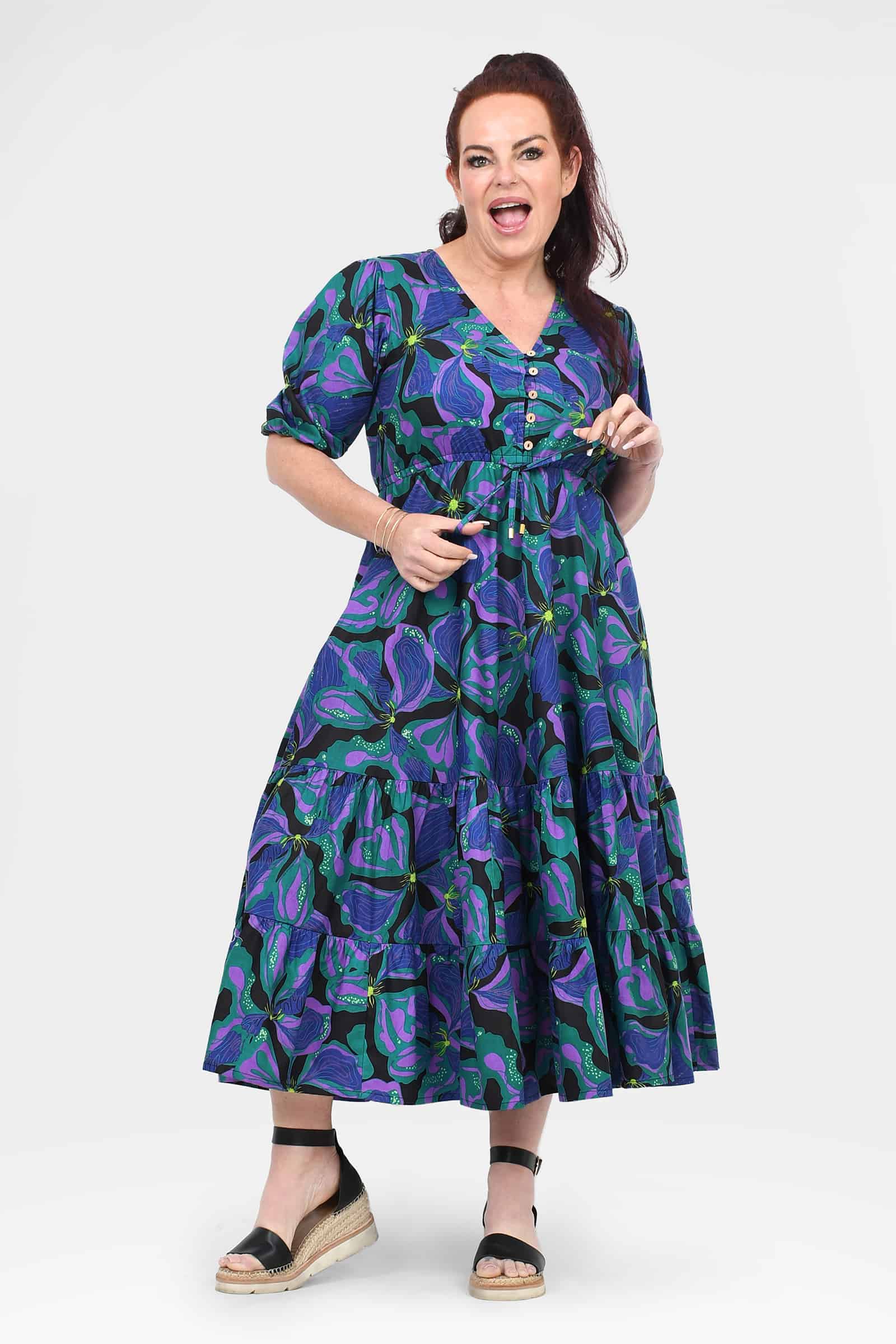 Teal midi dress with purple abstract leaf pattern, puff sleeves and button front, tiered skirt