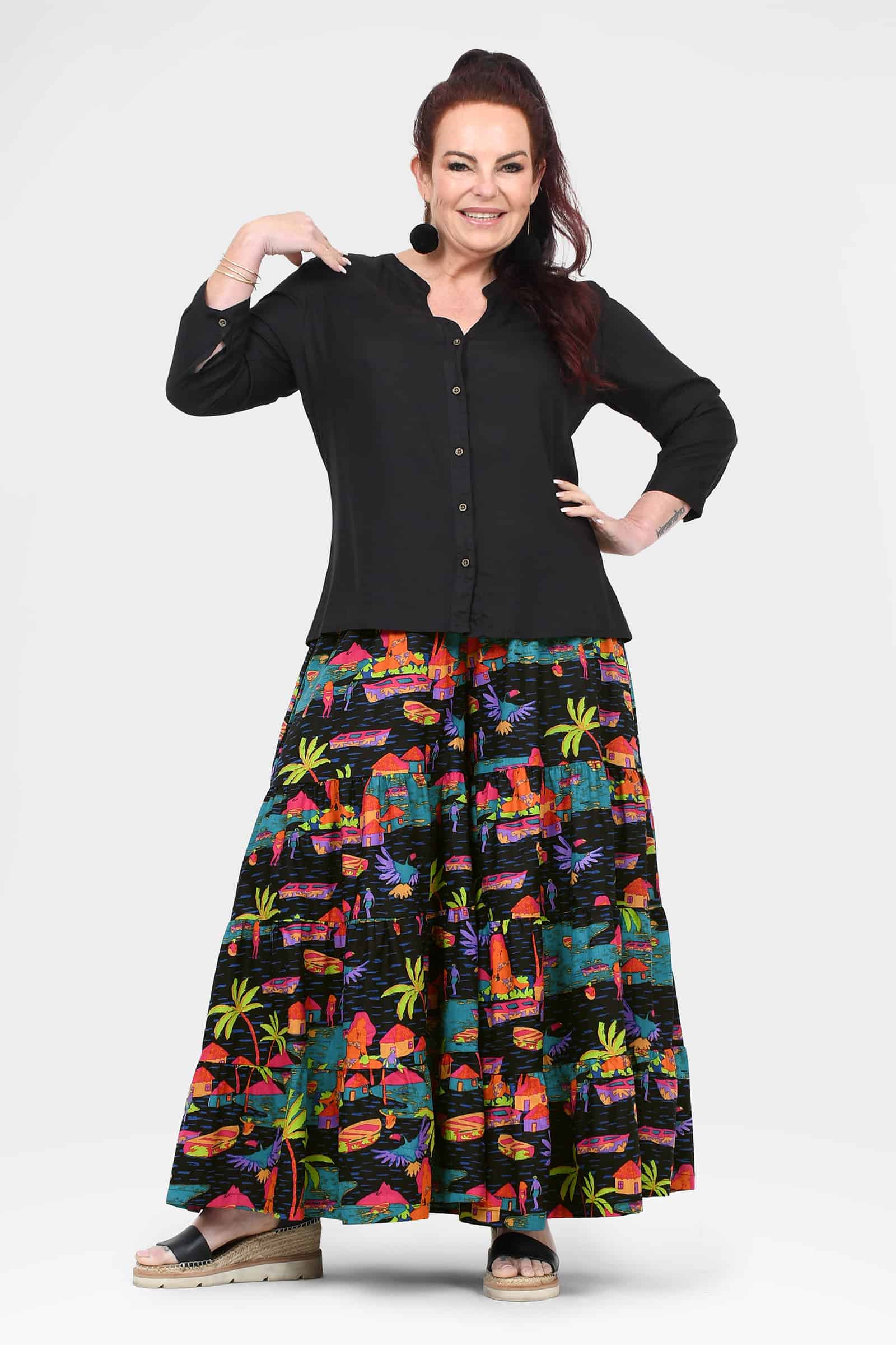 Havana wide-leg pants, black with colorful tropical city print, flared hem