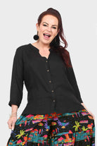 Black button-front top with V-neck and 3/4 sleeves
