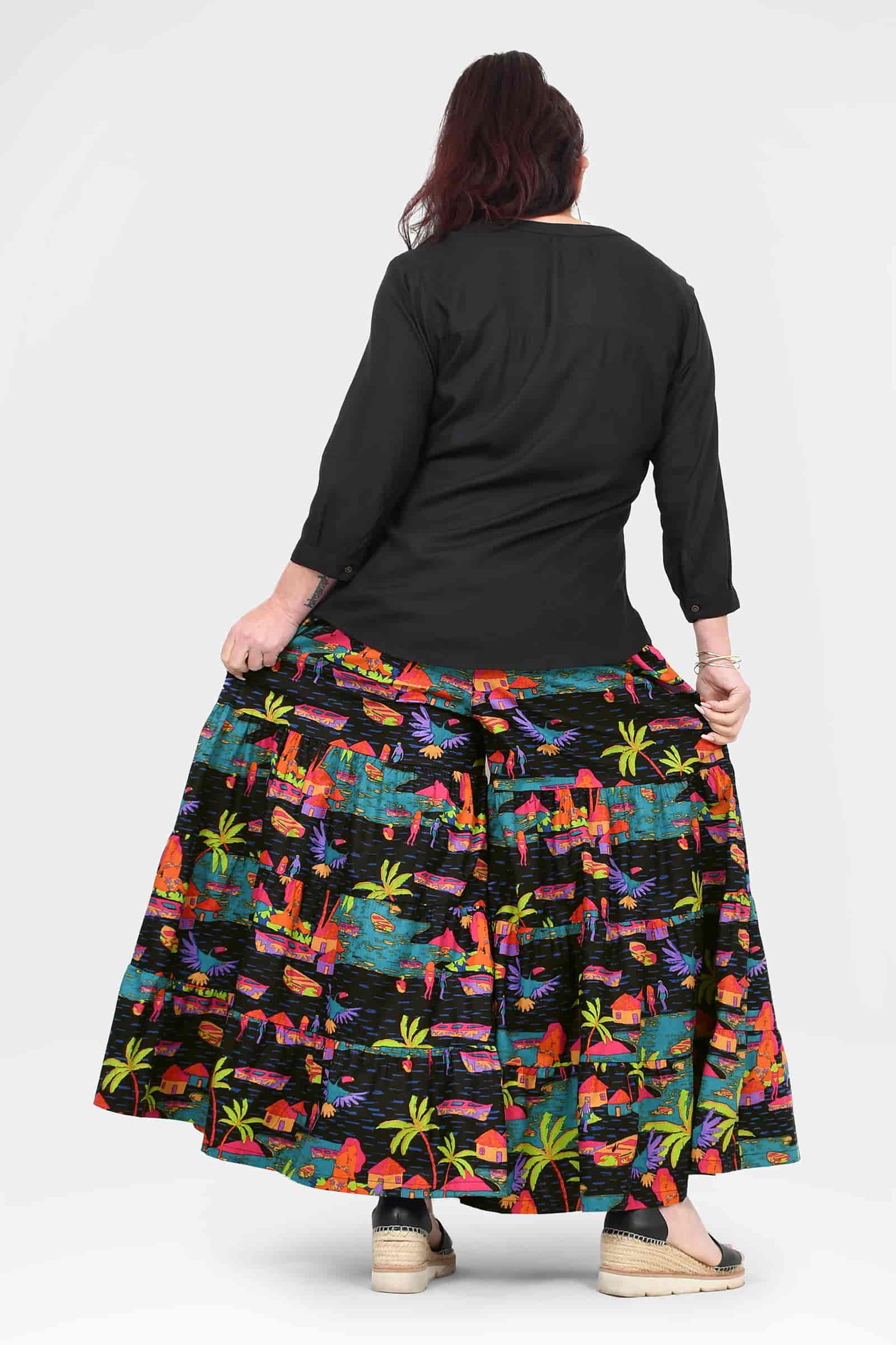 Havana wide-leg pants, black with colorful tropical print, back view, flared hem