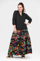 Havana wide-leg pants, black with vibrant tropical city print, relaxed fit, flared hem